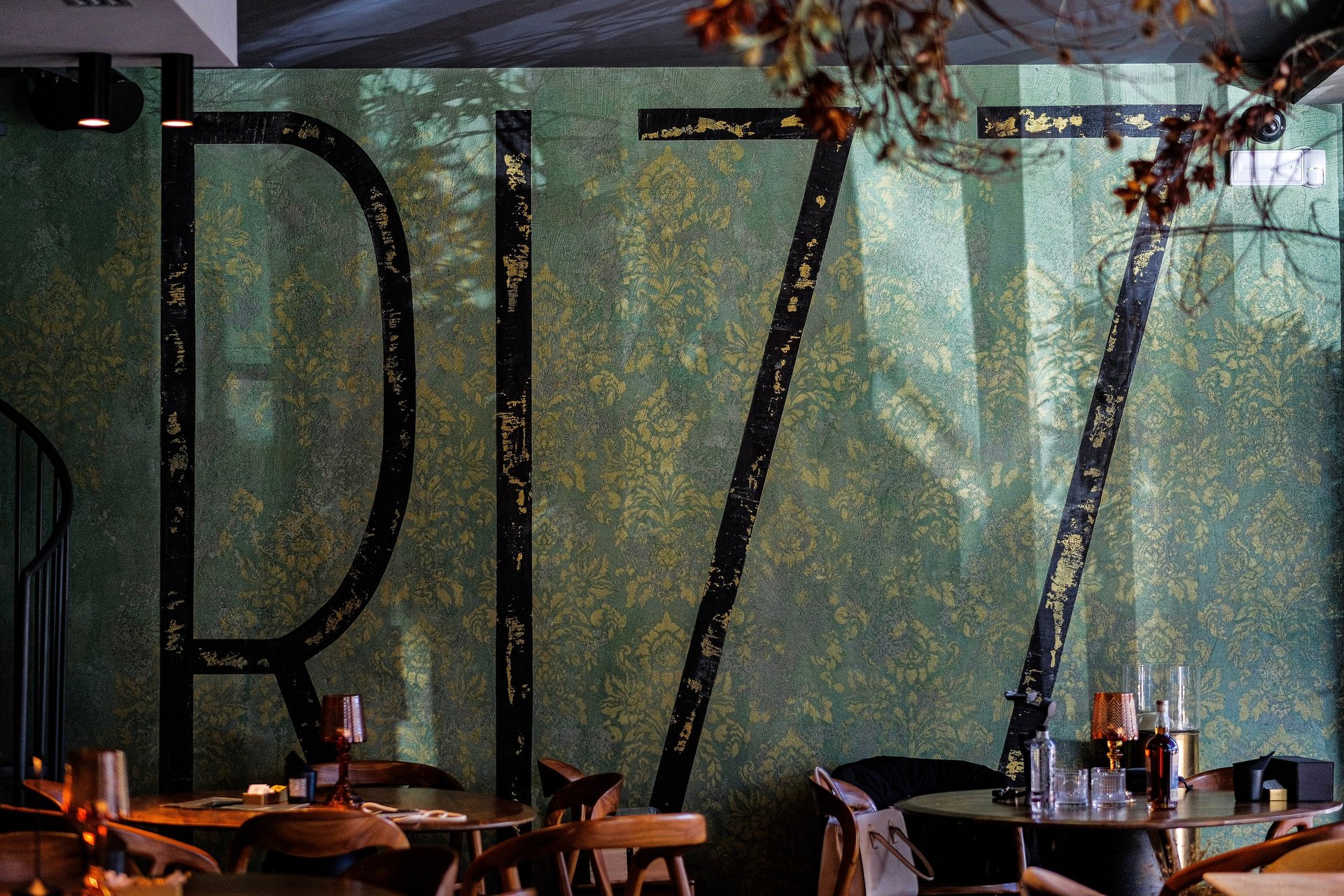 an abstract photo of a curved building with a blue sky in the background
