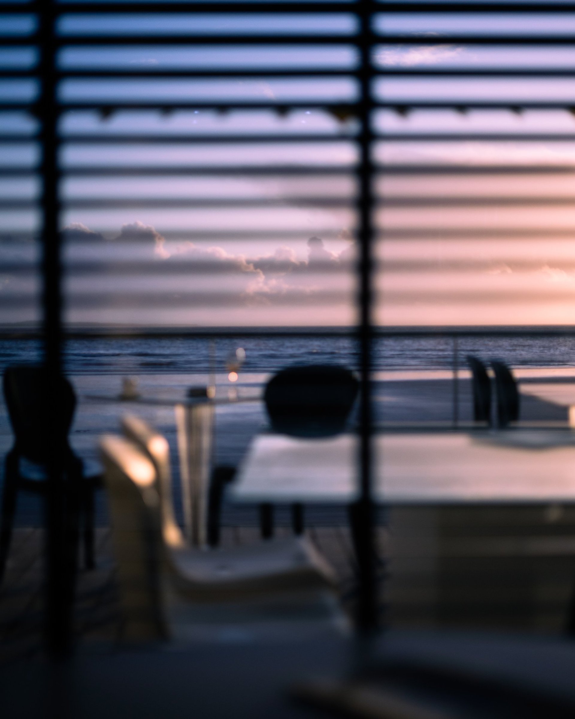 an abstract photo of a curved building with a blue sky in the background