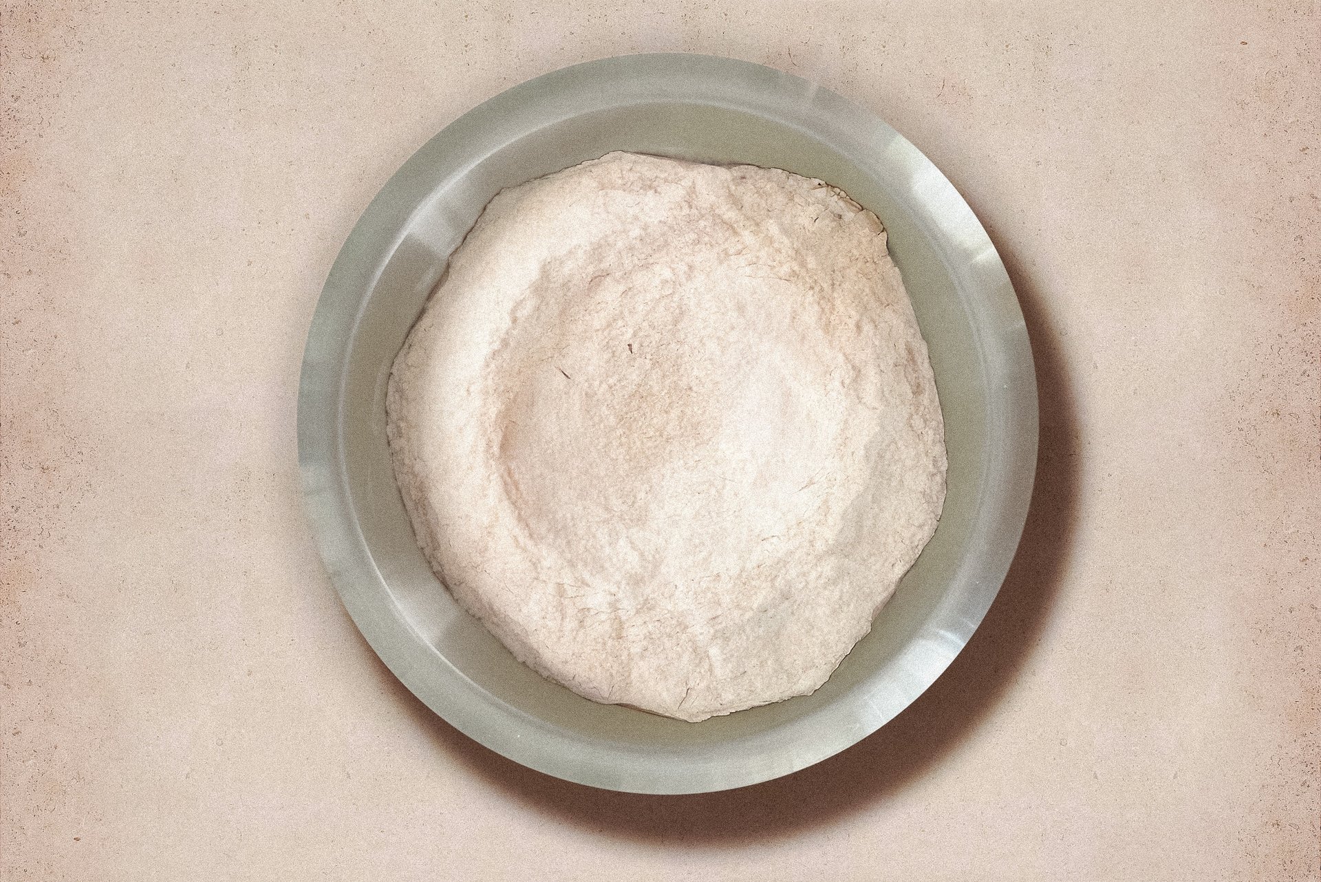 an abstract photo of a curved building with a blue sky in the background