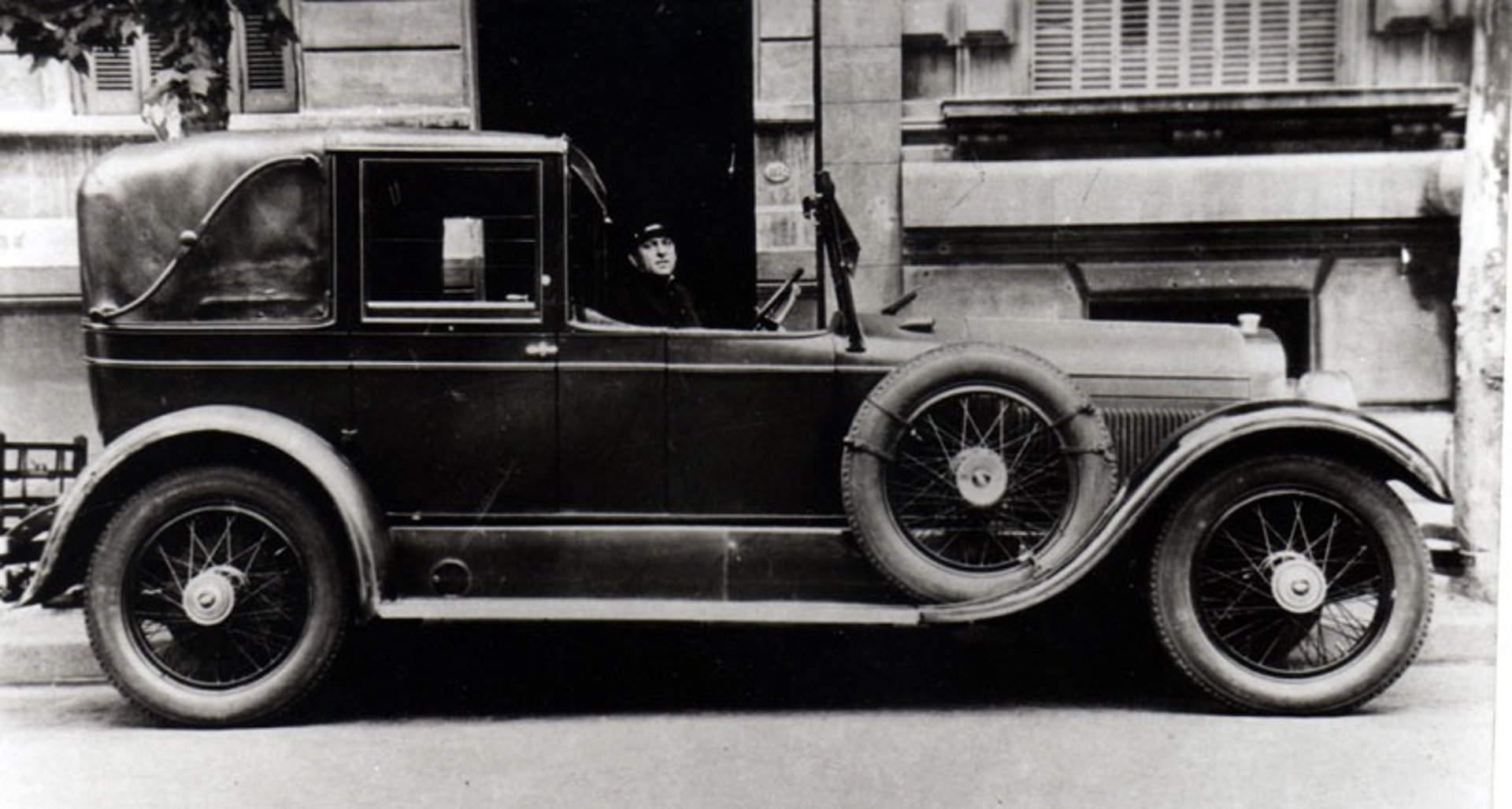 an abstract photo of a curved building with a blue sky in the background