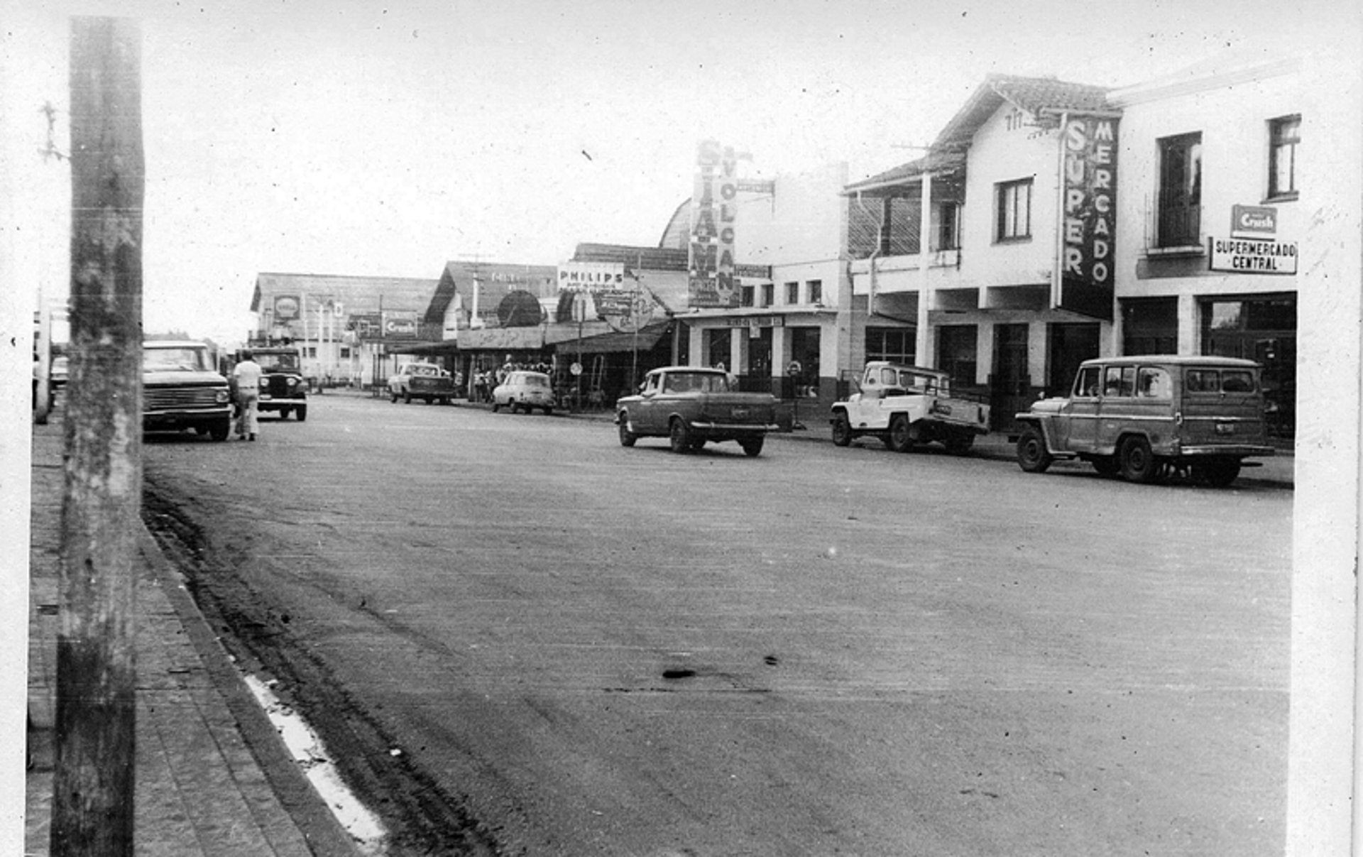 an abstract photo of a curved building with a blue sky in the background