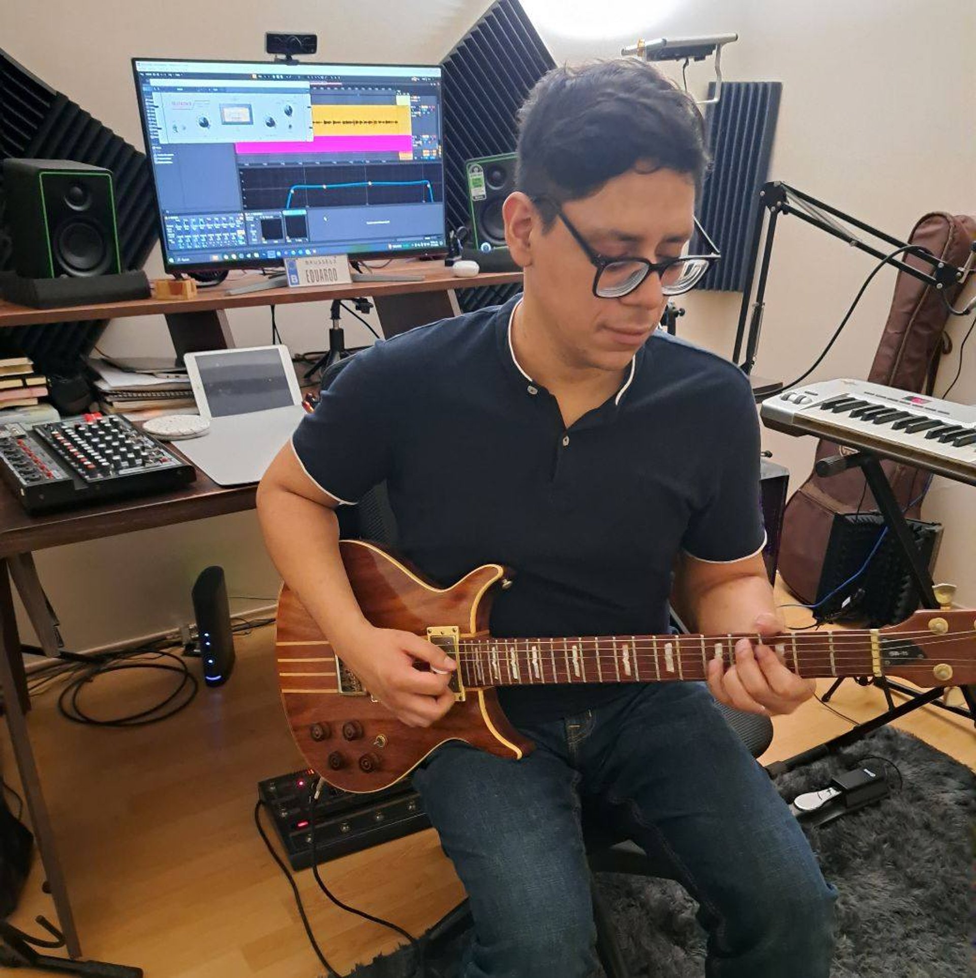 teal and brown electric guitar