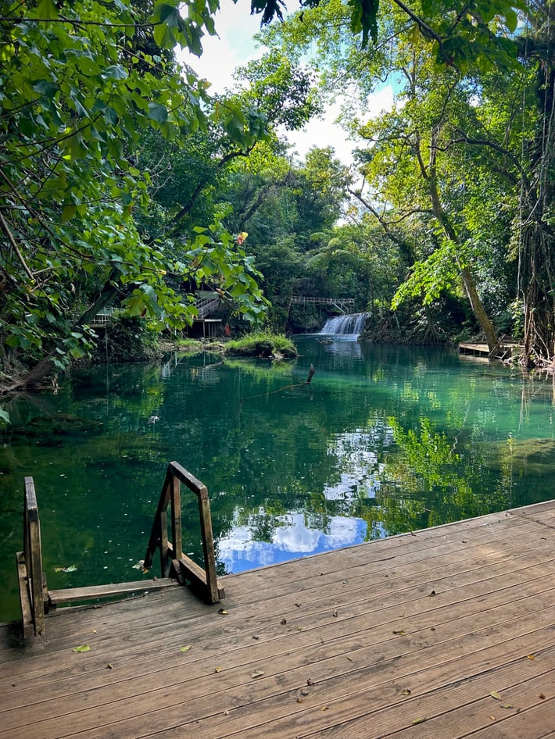 an abstract photo of a curved building with a blue sky in the background