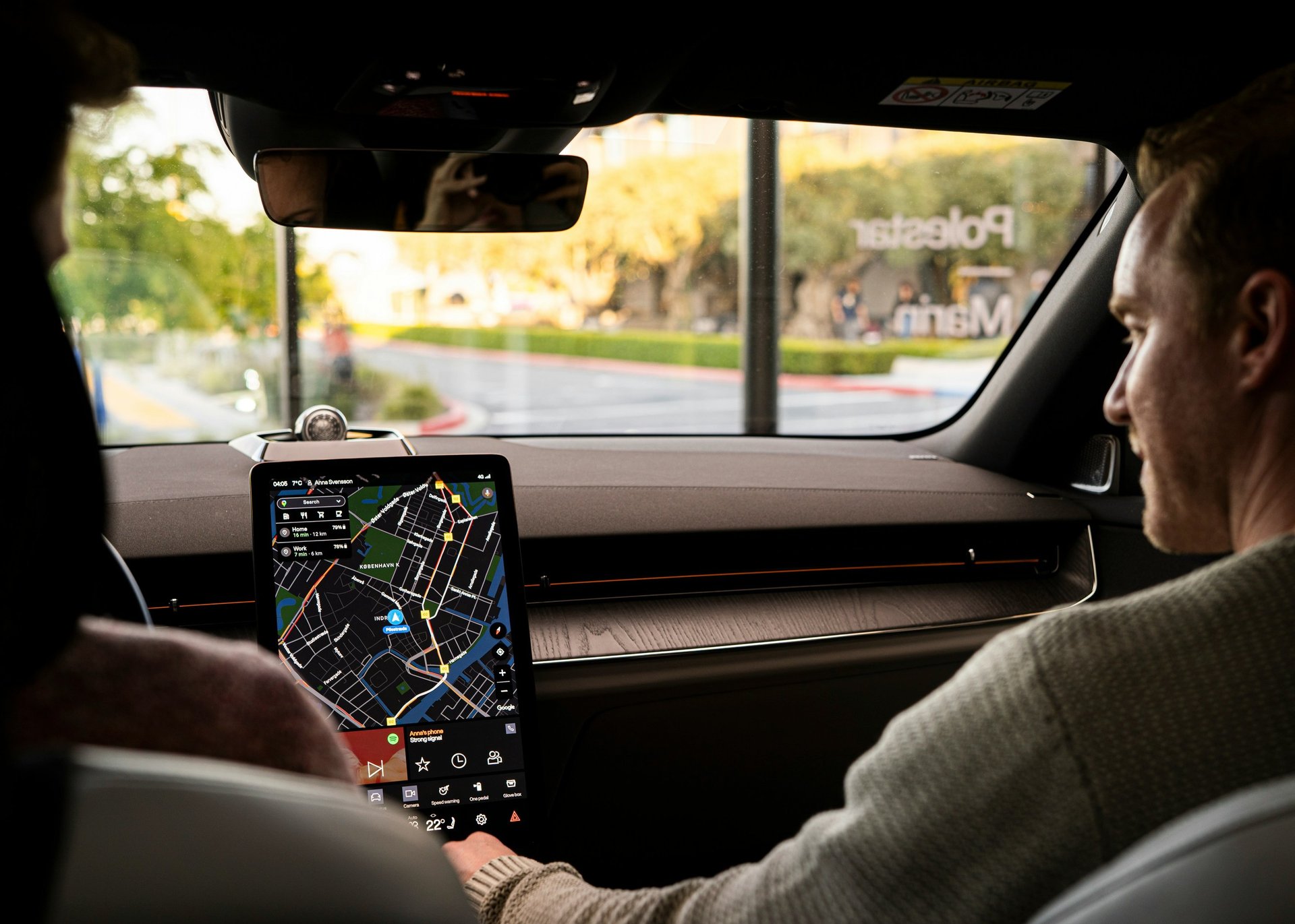 a car dashboard with a radio and a charger