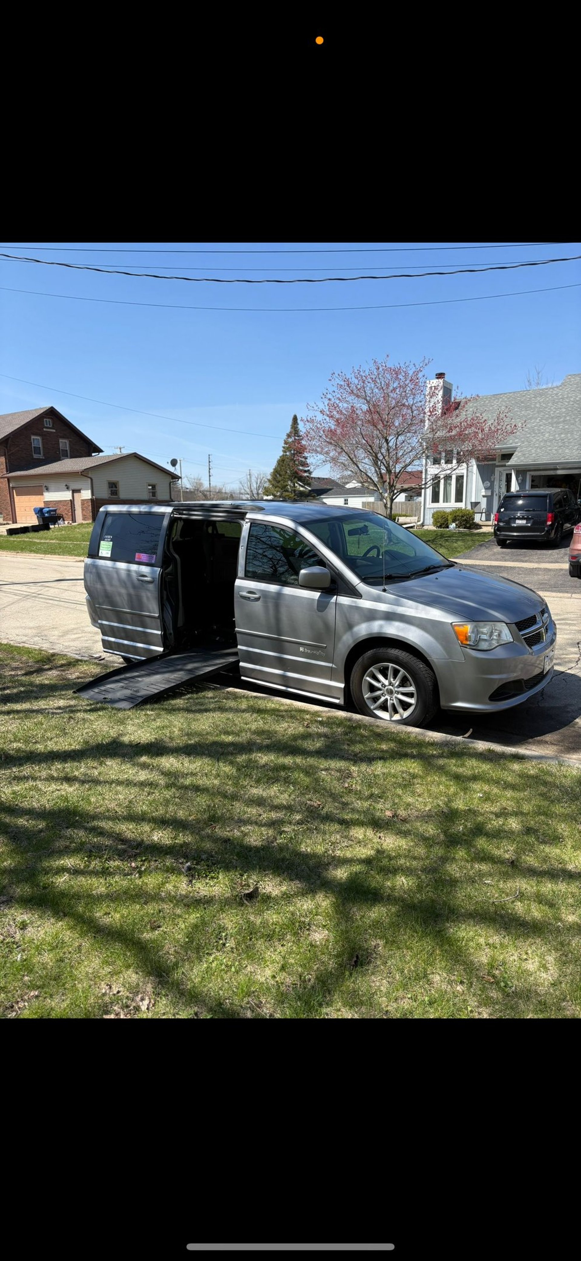 woman wearing yellow long-sleeved dress under white clouds and blue sky during daytime