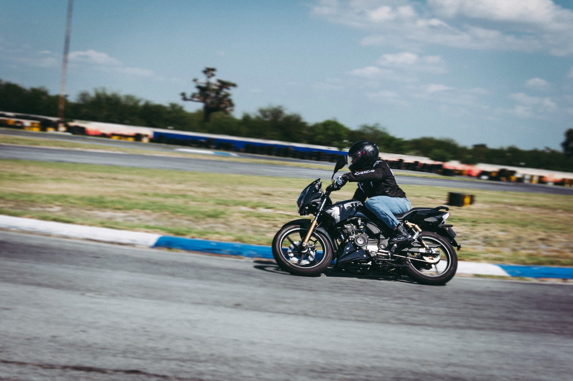an abstract photo of a curved building with a blue sky in the background