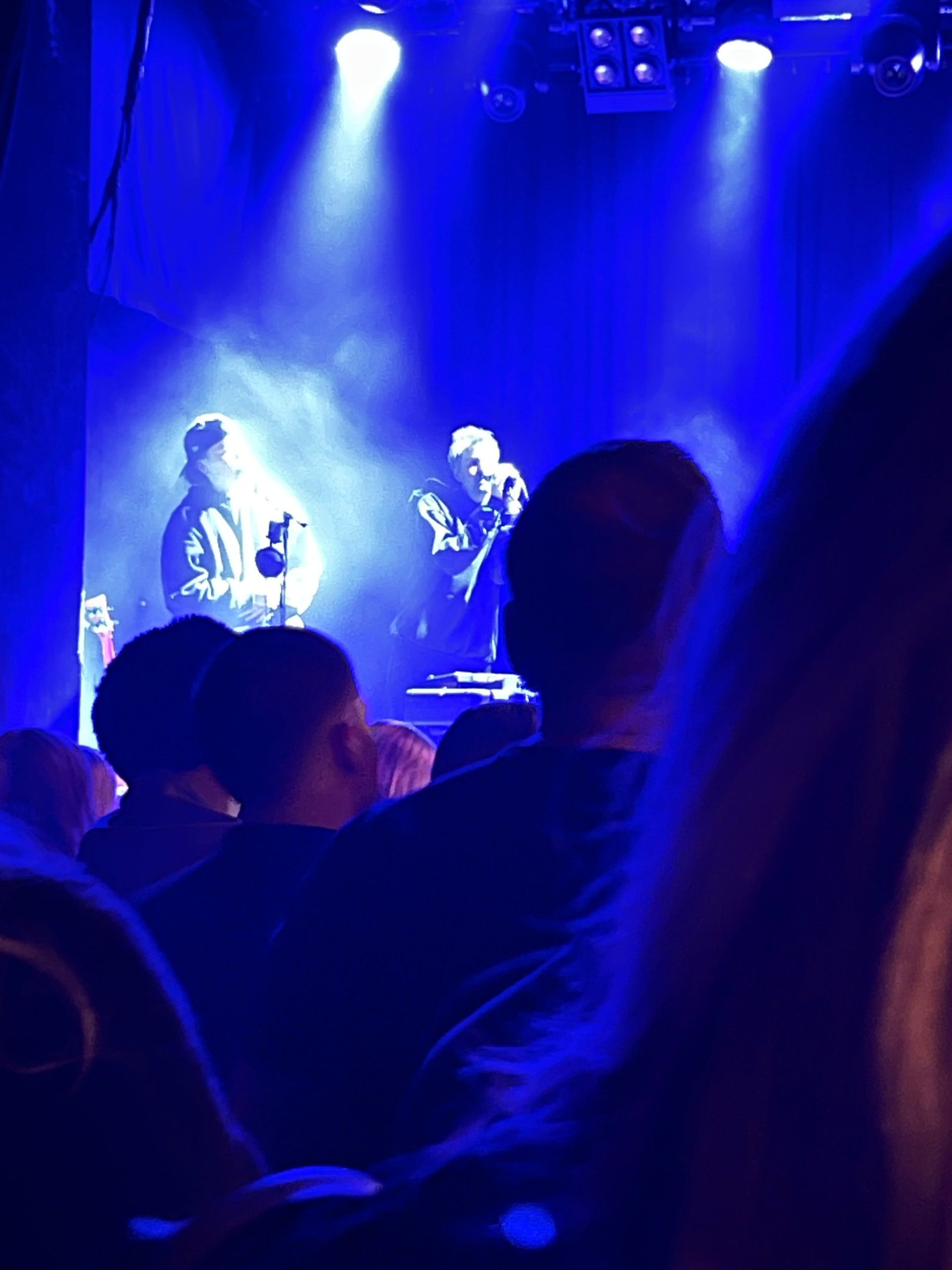 an abstract photo of a curved building with a blue sky in the background