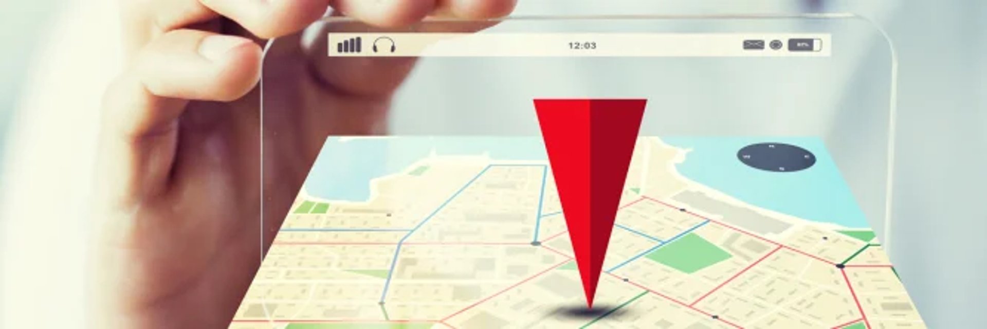 man sitting on concrete brick with opened laptop on his lap