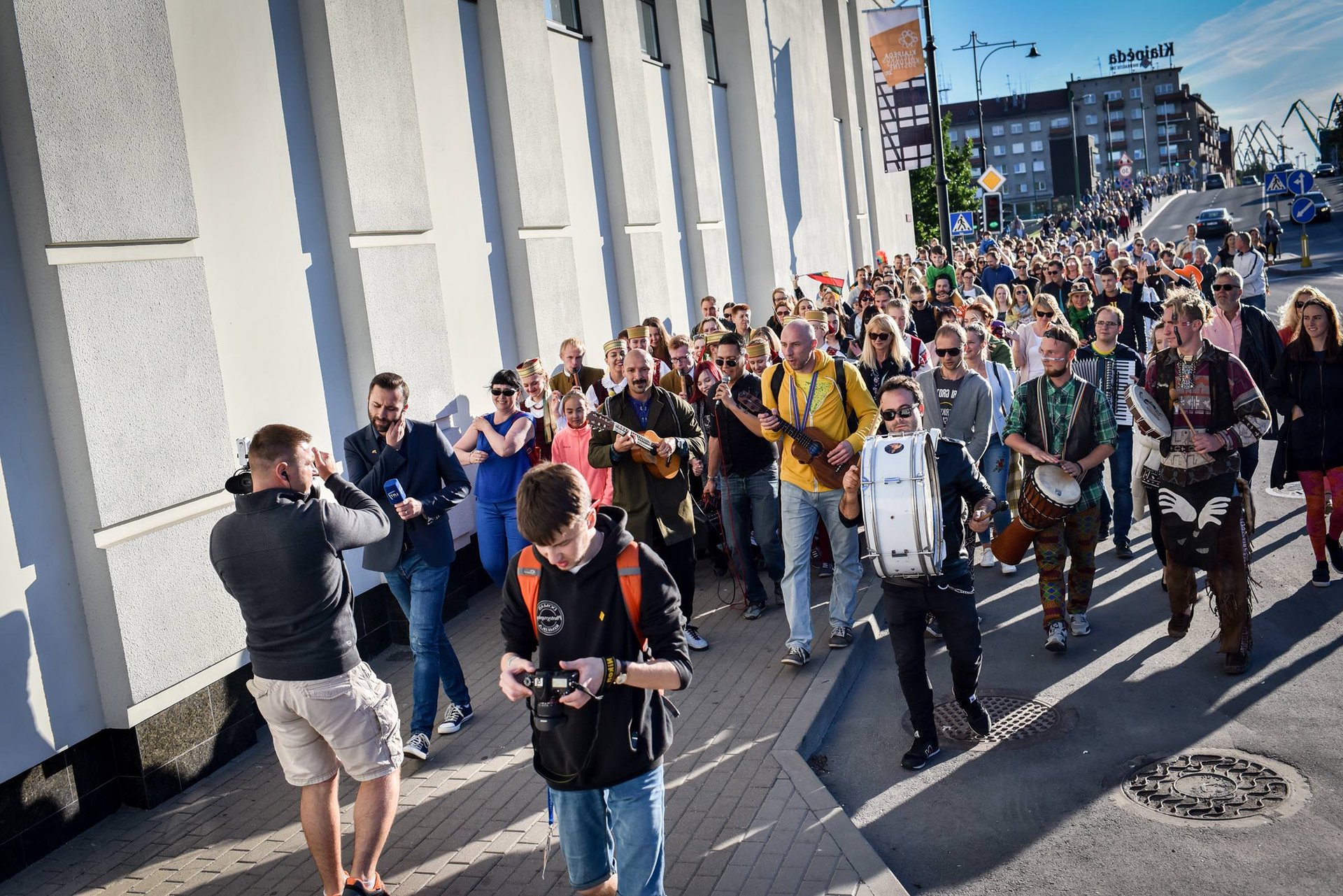 woman in white and brown dress standing on green grass during night time