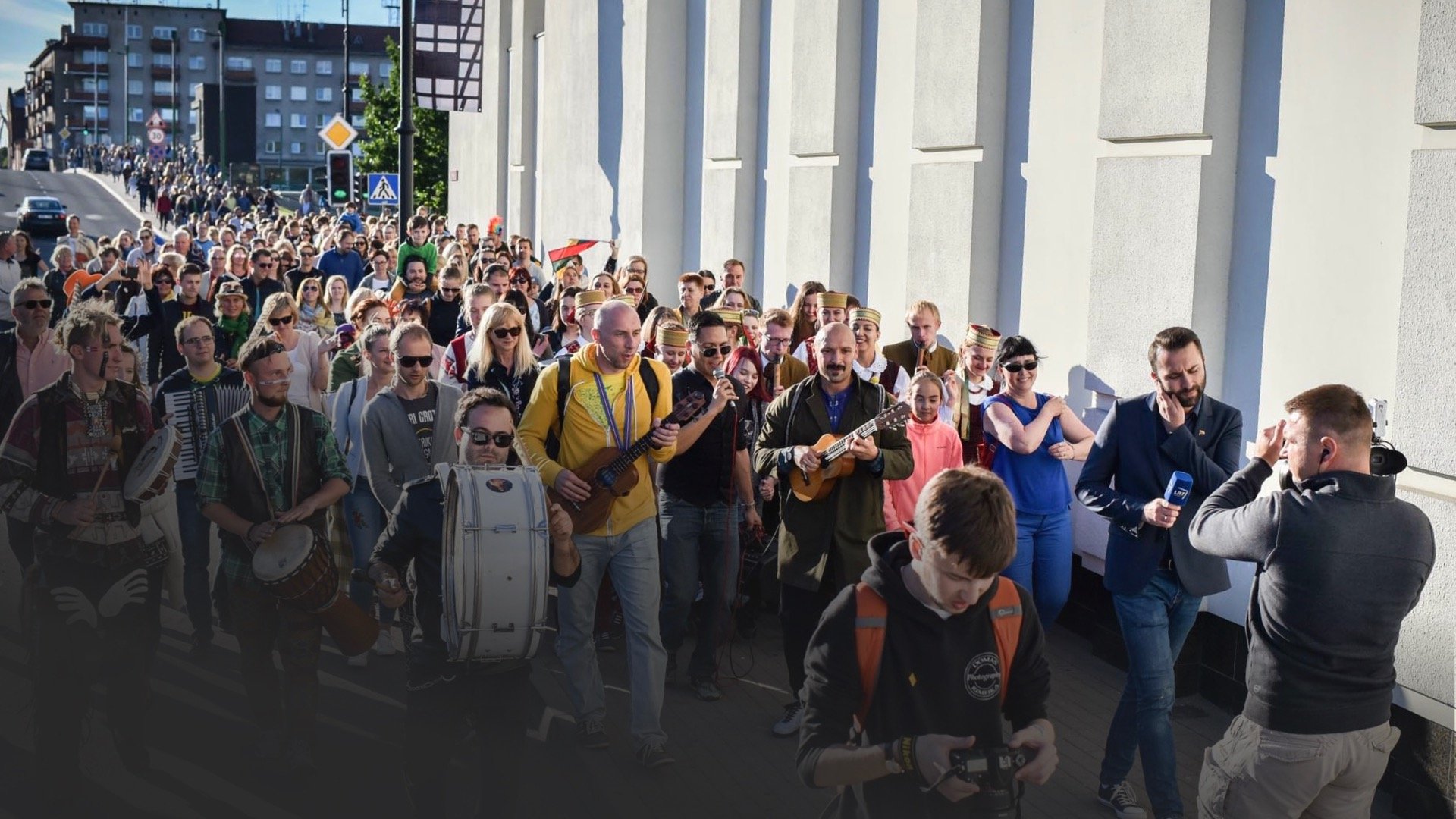 woman in white and brown dress standing on green grass during night time
