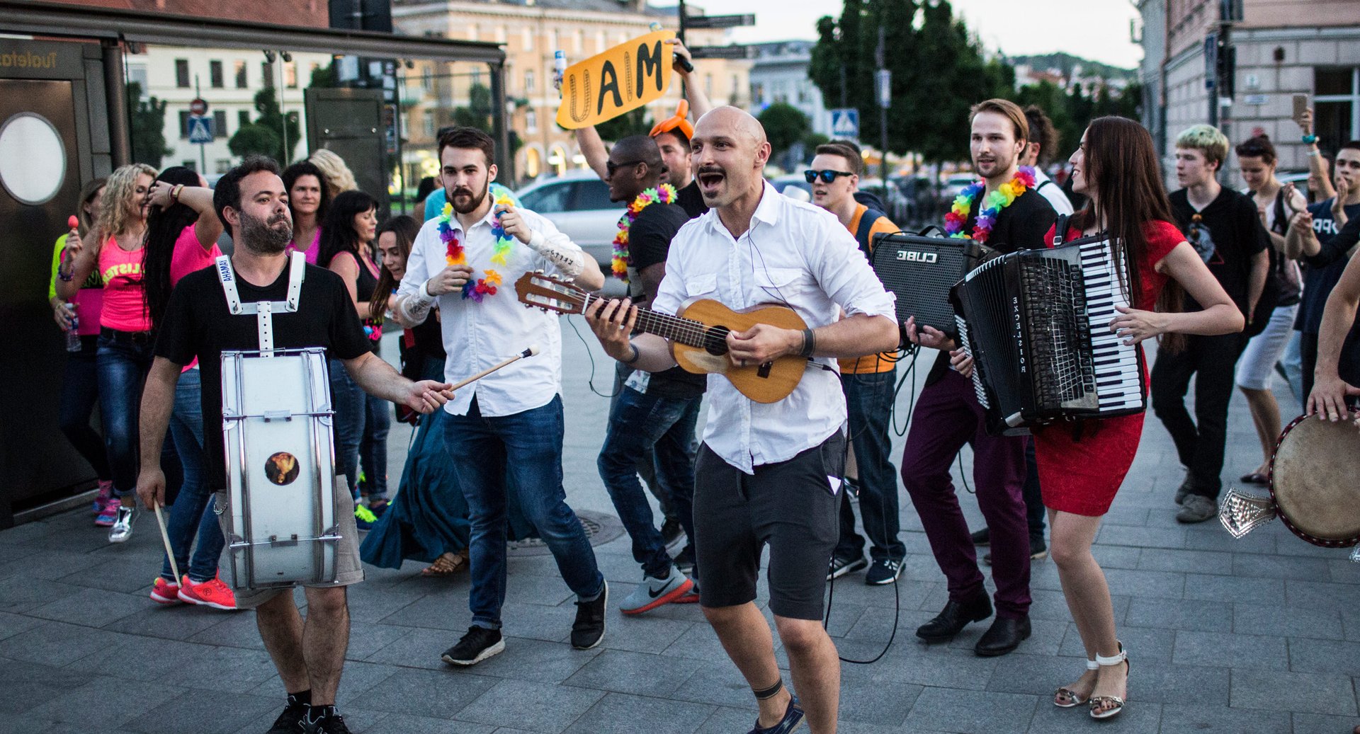 woman in white and brown dress standing on green grass during night time