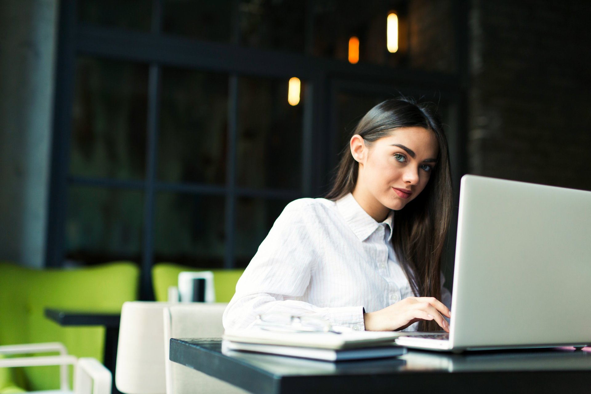 man and woman talking inside office