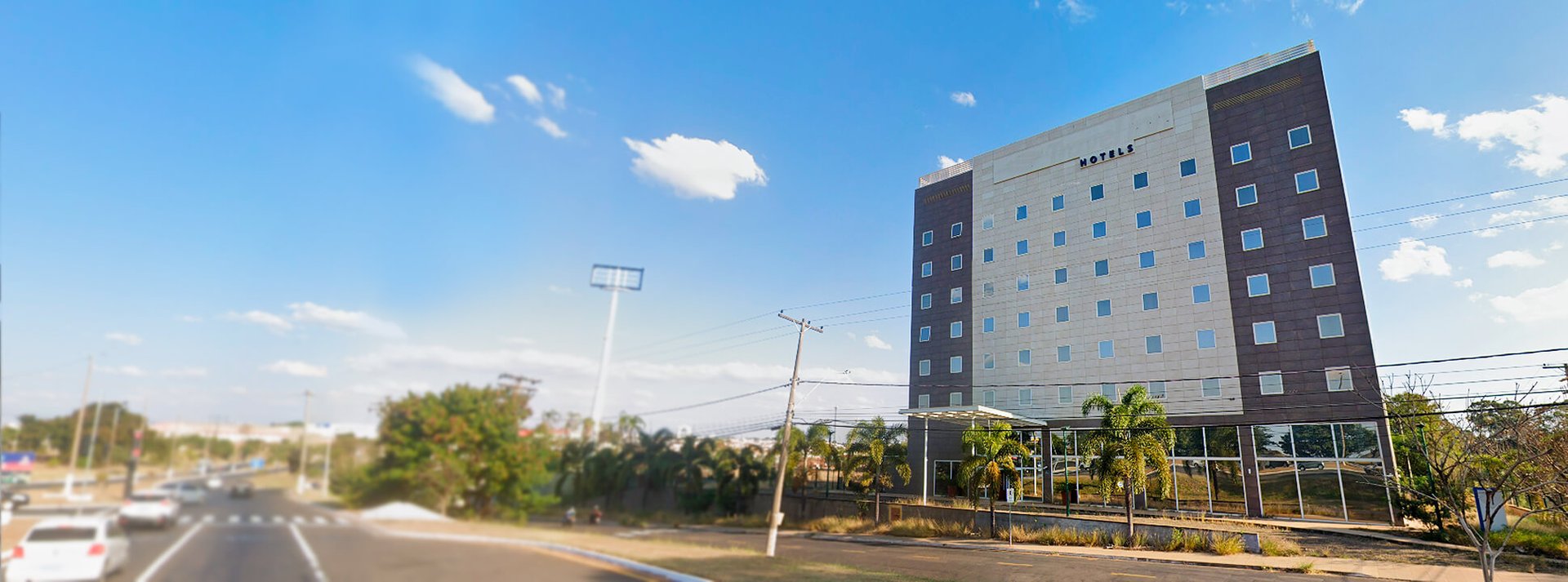 an abstract photo of a curved building with a blue sky in the background