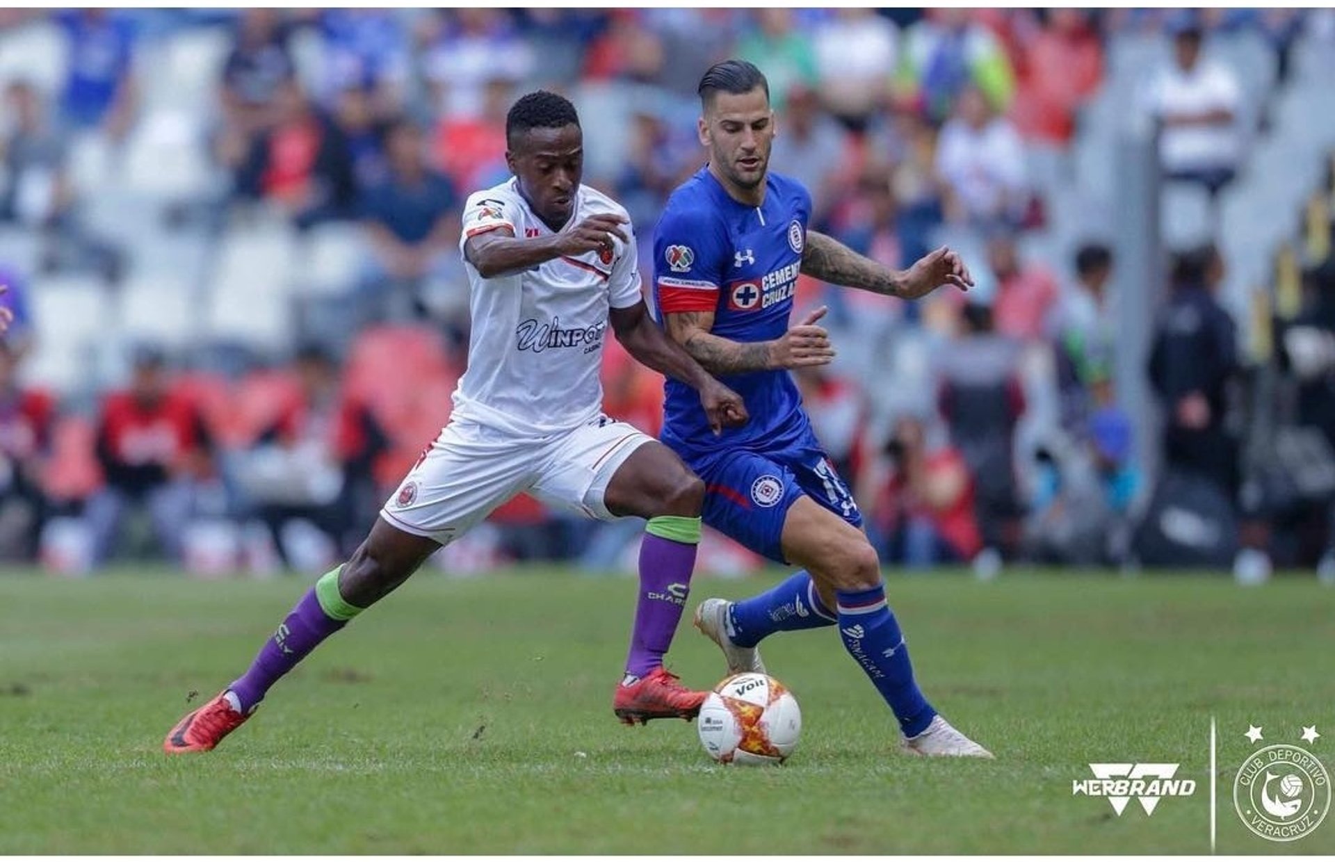 green soccer field inside stadium