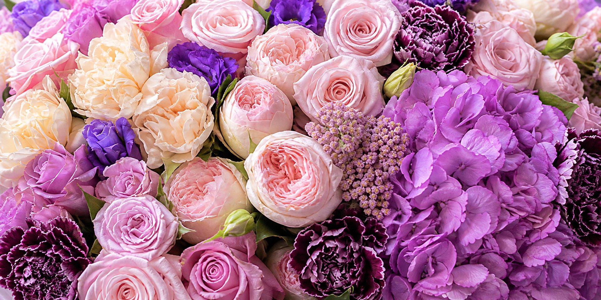 pink flowers in clear glass vase