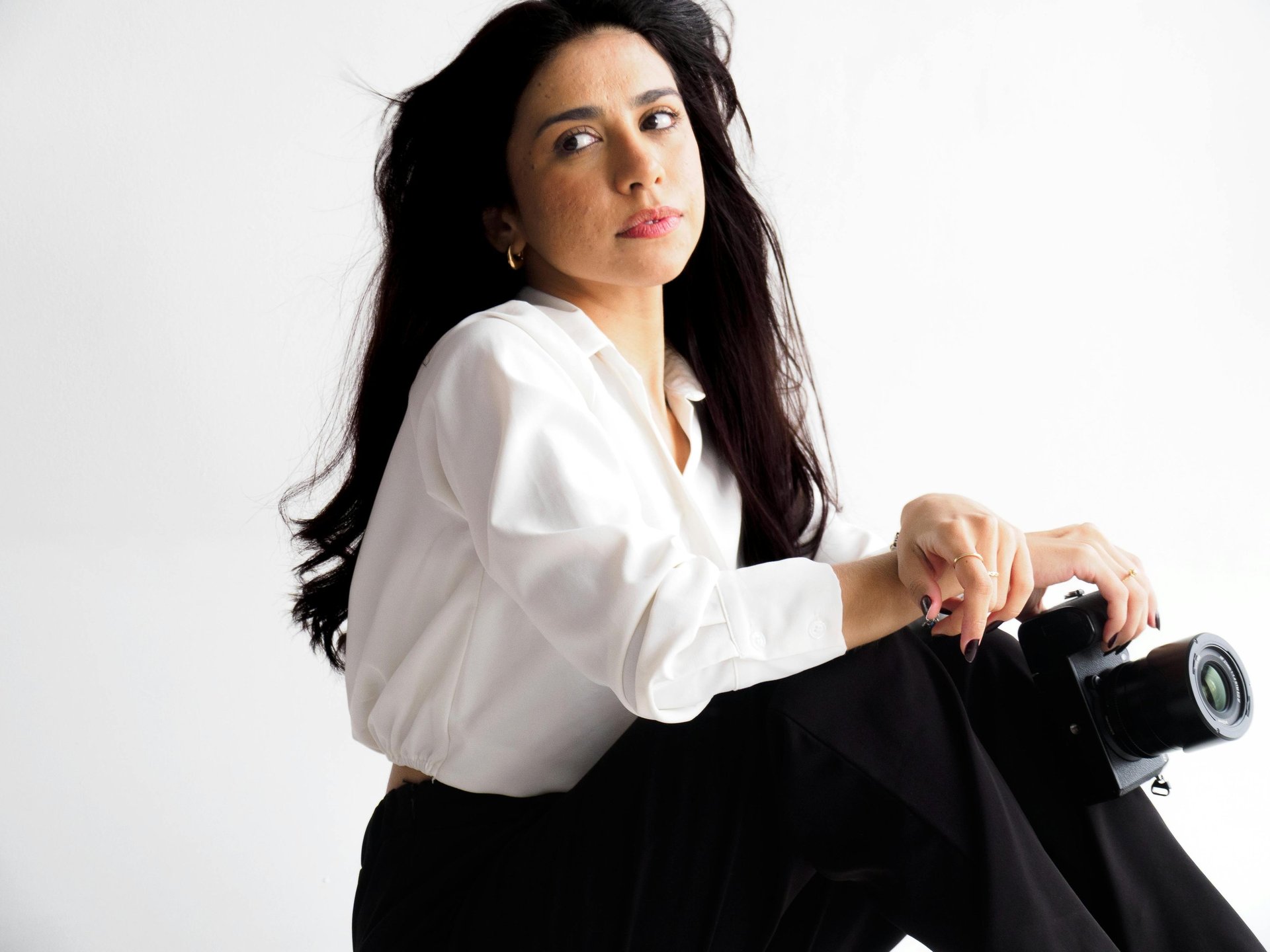 Three co-workers sitting together in the office with Surface laptop on the table