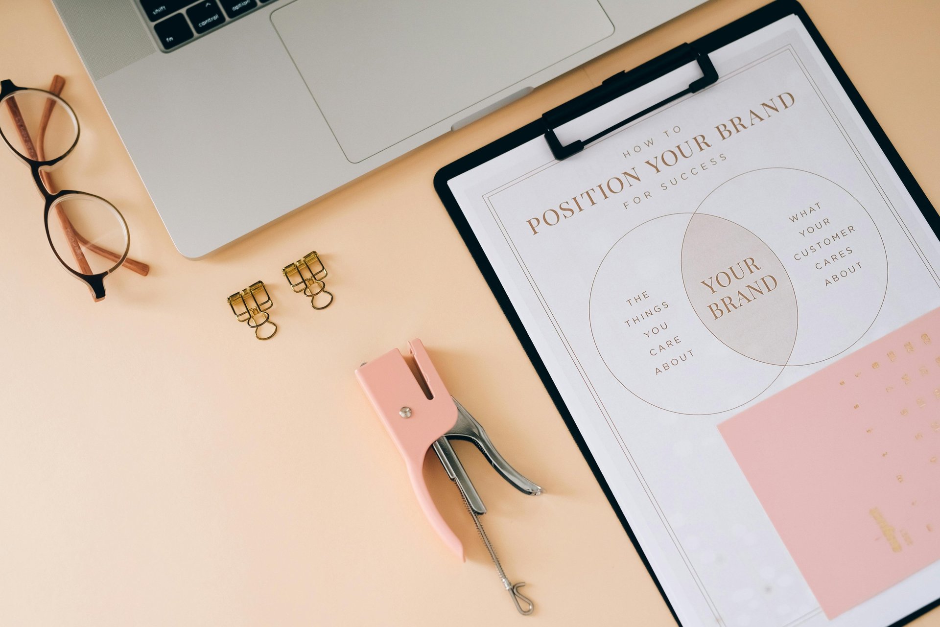 Three co-workers sitting together in the office with Surface laptop on the table