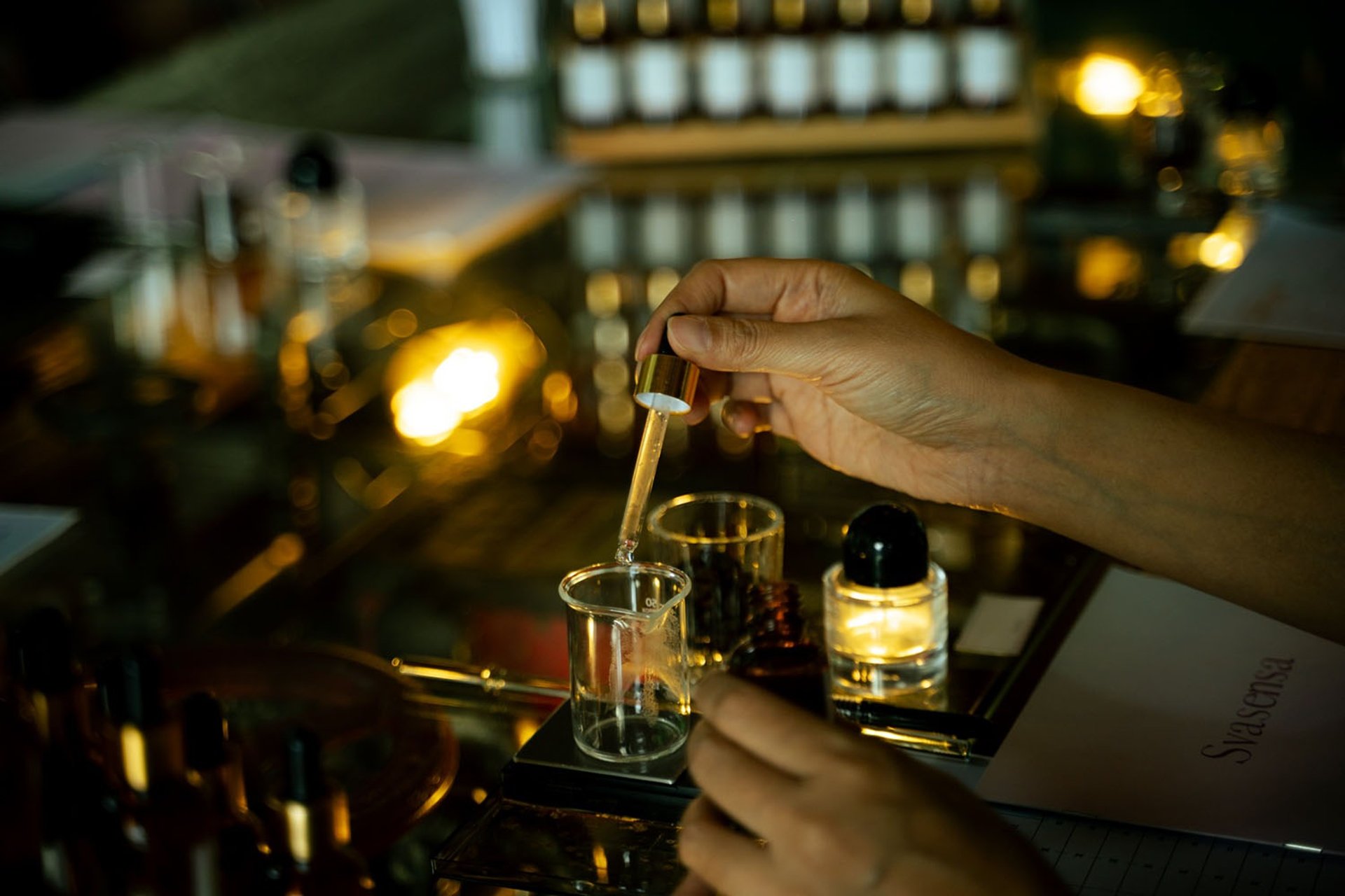 waterfalls in between green trees at daytime