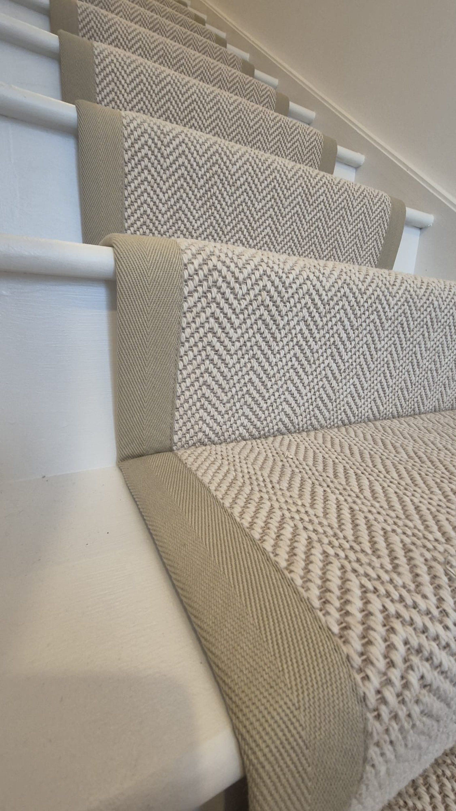 an abstract photo of a curved building with a blue sky in the background