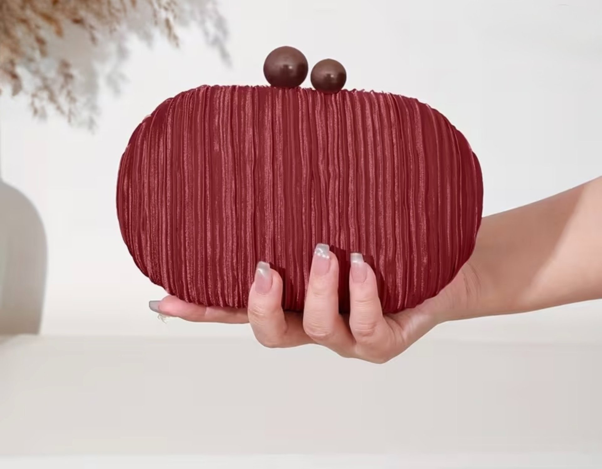 red leather flip case on white textile