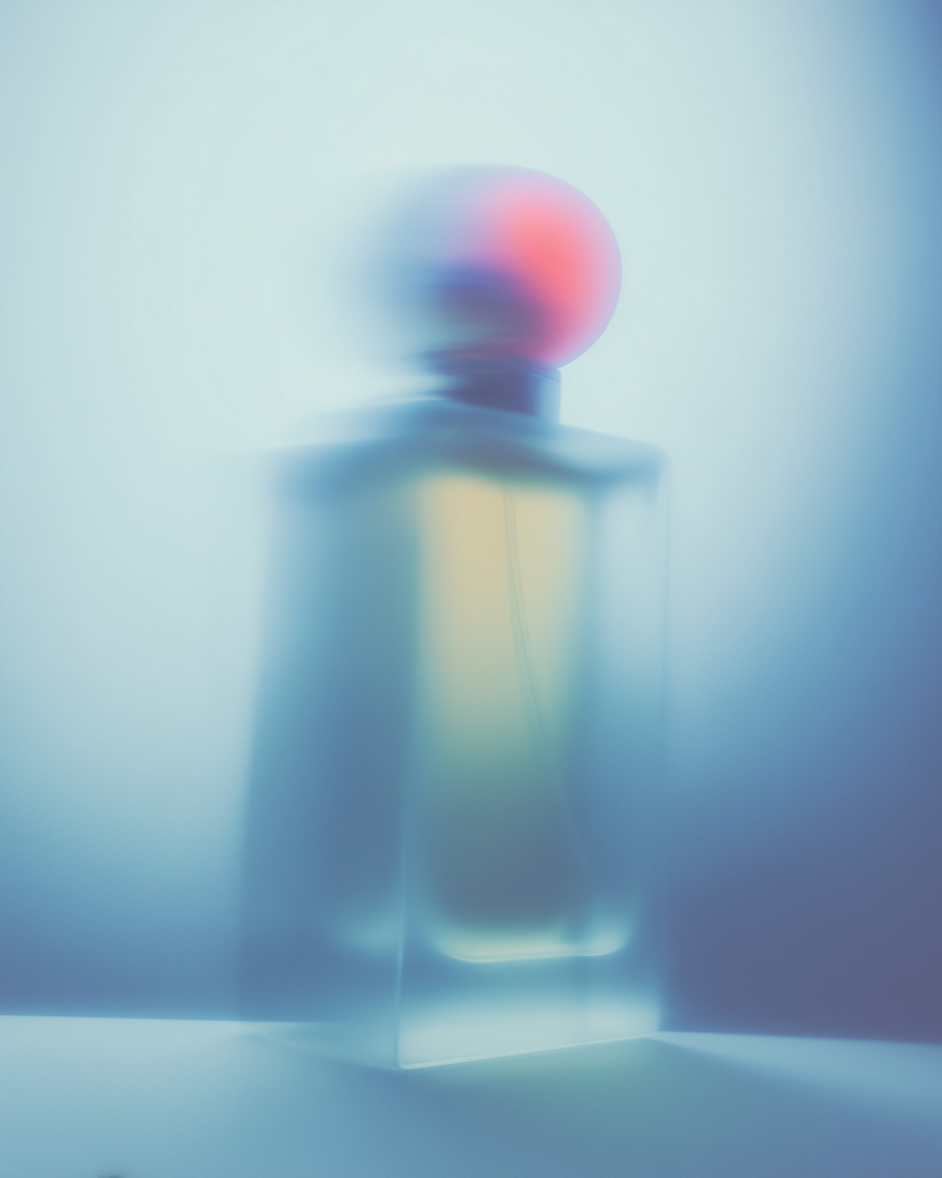 an abstract photo of a curved building with a blue sky in the background