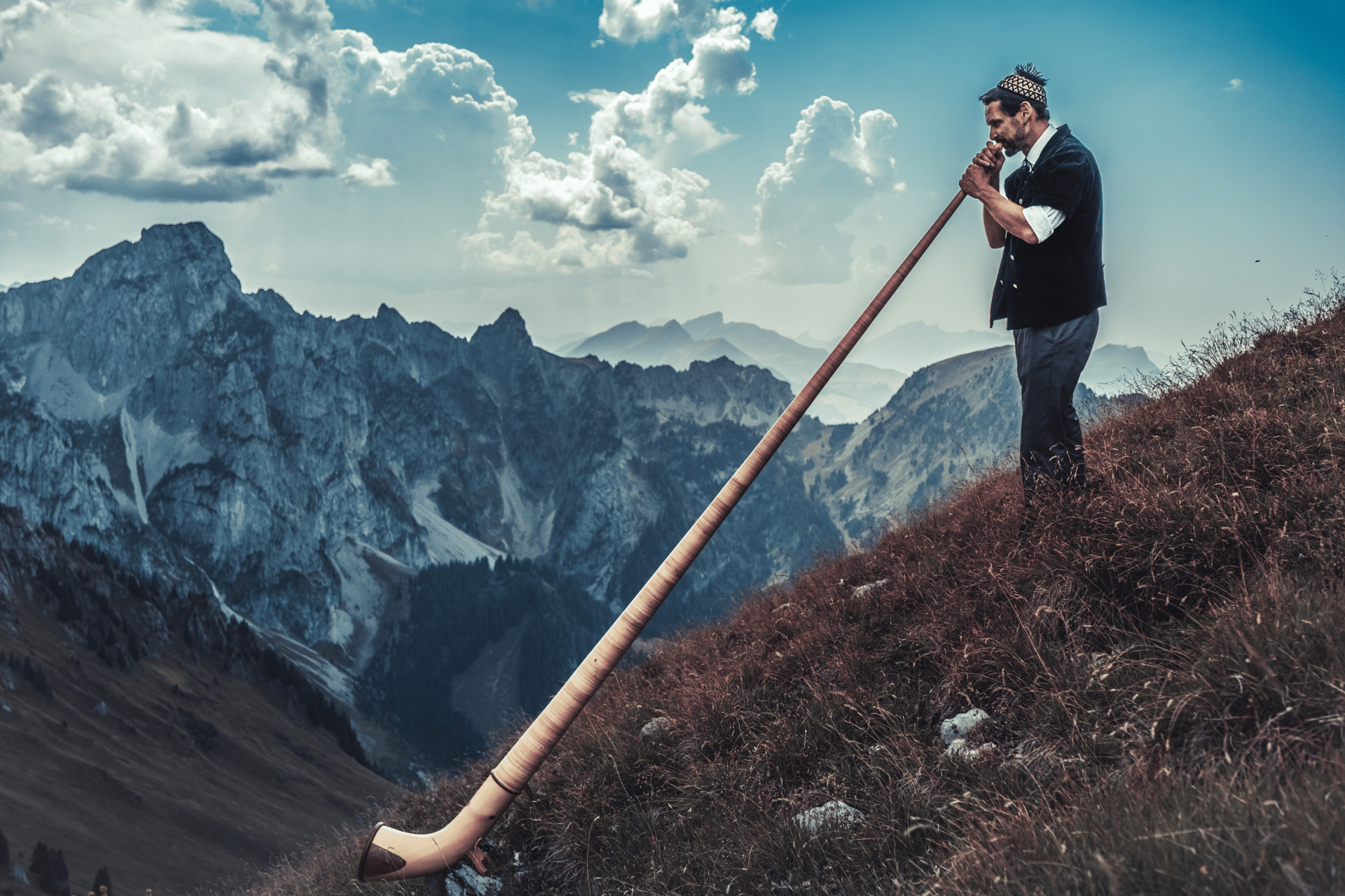 an abstract photo of a curved building with a blue sky in the background