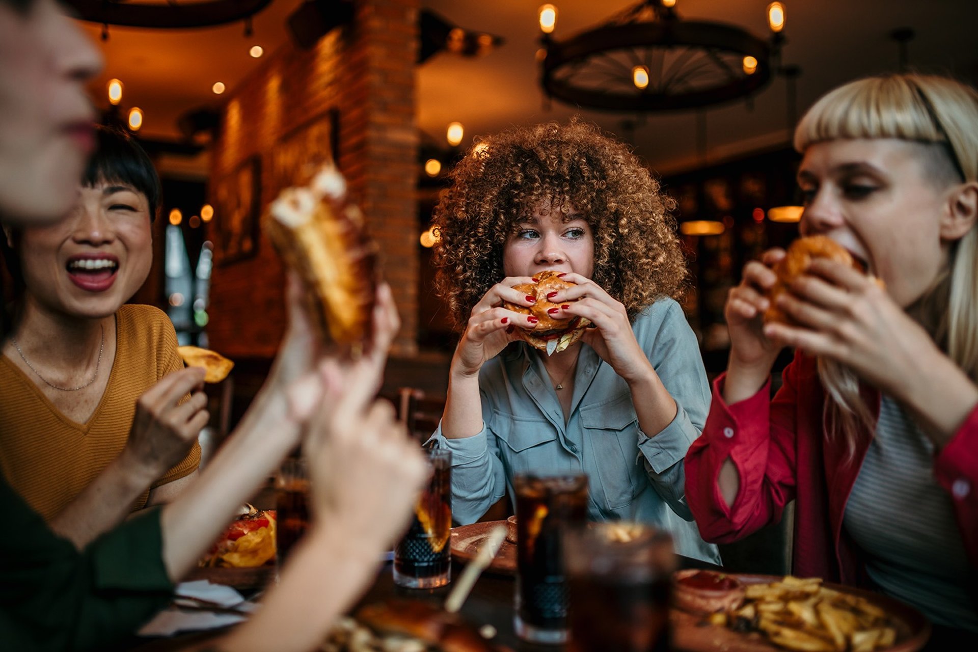 an abstract photo of a curved building with a blue sky in the background