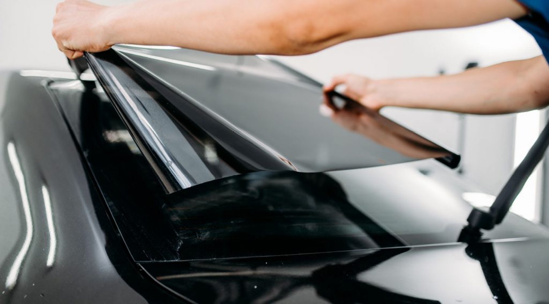 an abstract photo of a curved building with a blue sky in the background