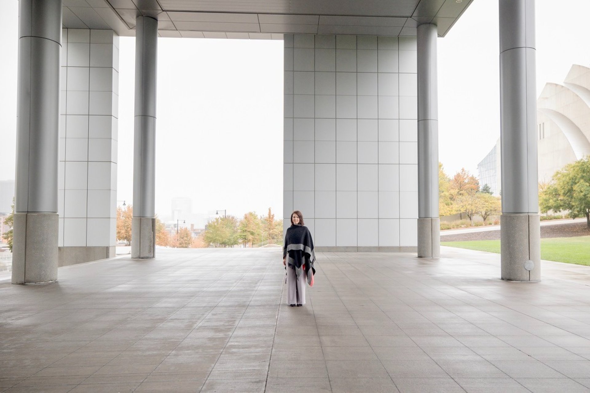 person holding gold wedding band