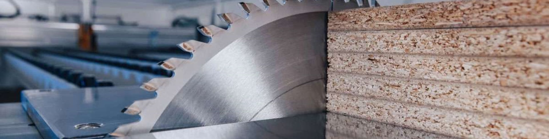 green leafed plant in blue top on top of brown table