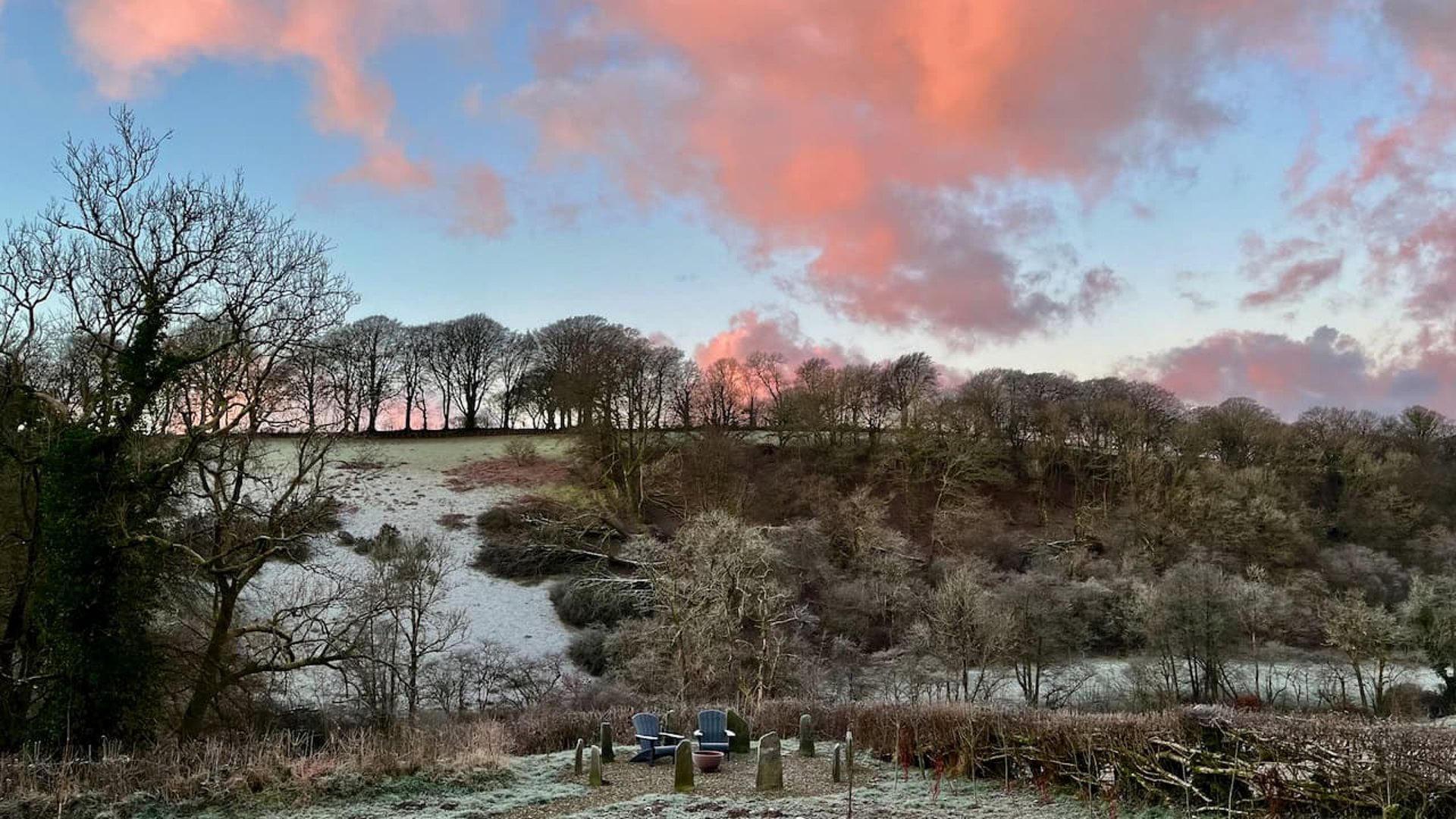 view of the valley with pink clouds in the morning