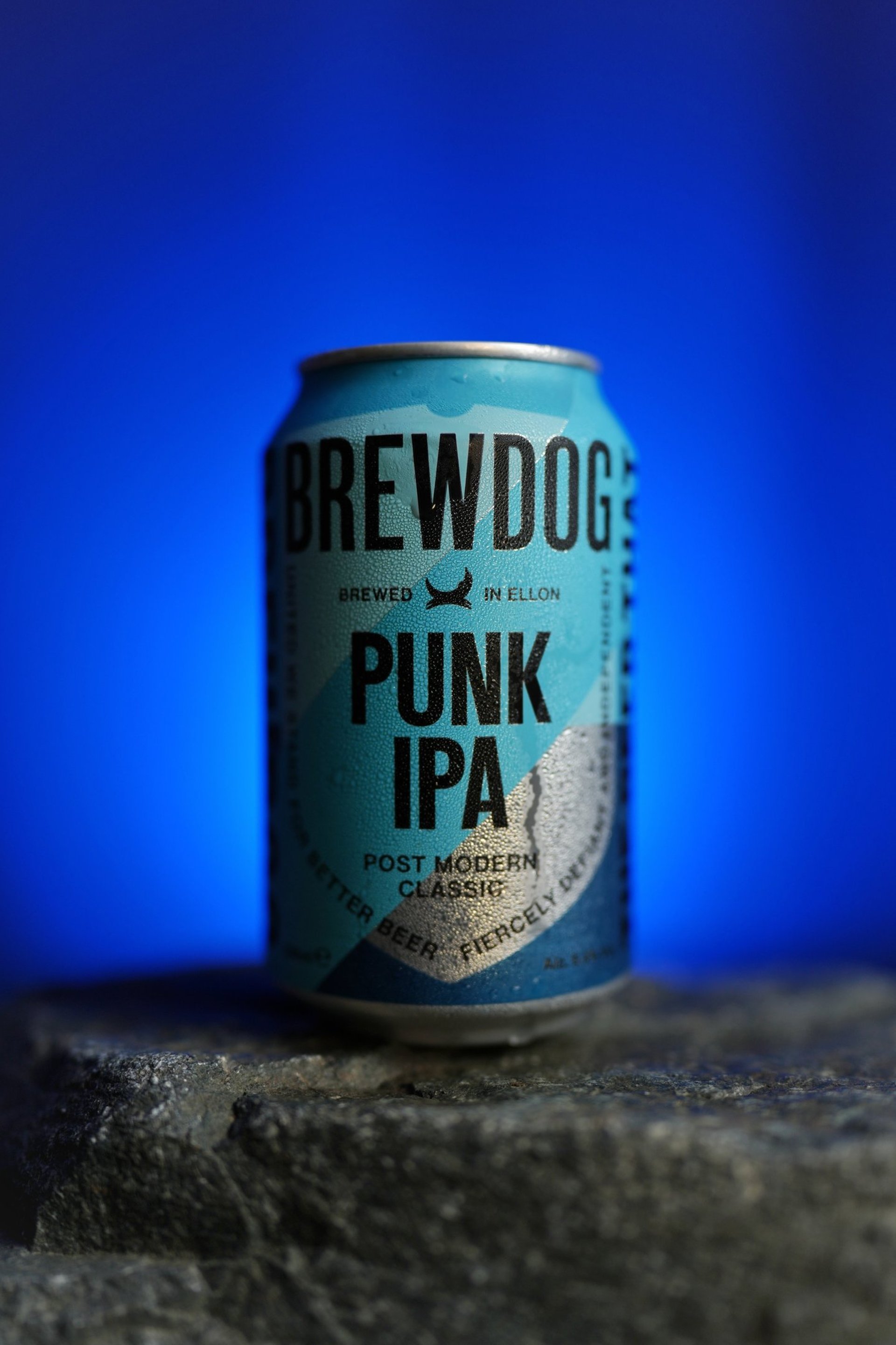 an abstract photo of a curved building with a blue sky in the background