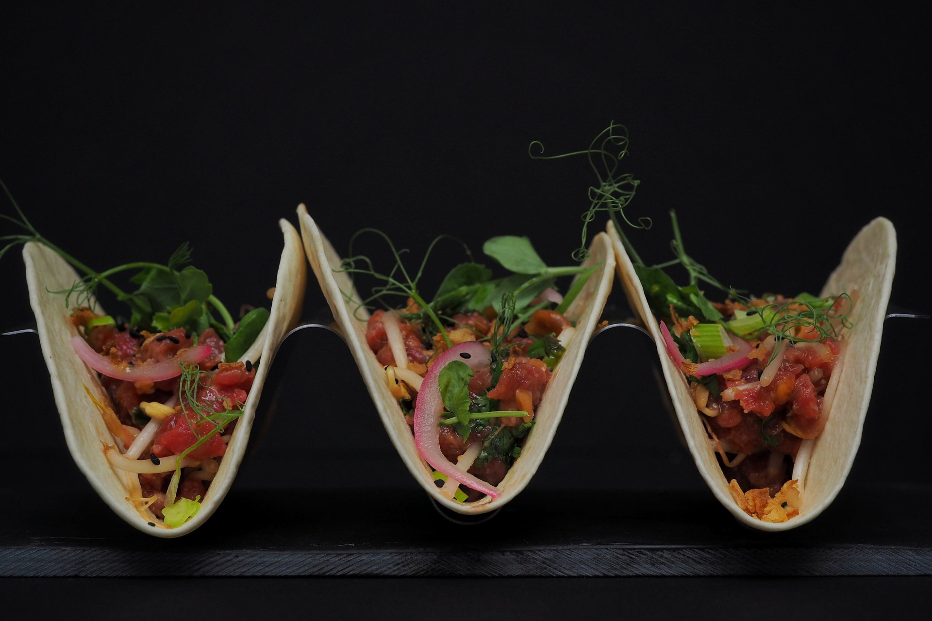 an abstract photo of a curved building with a blue sky in the background