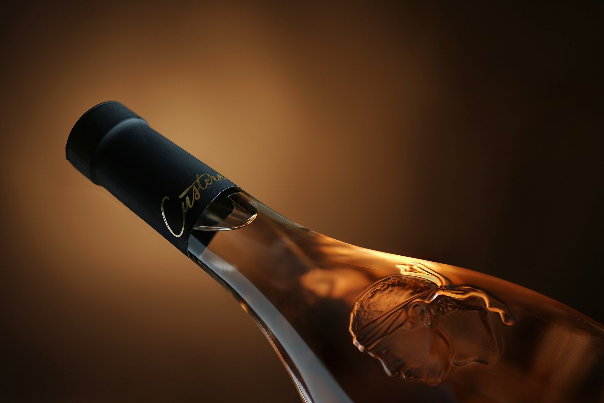 an abstract photo of a curved building with a blue sky in the background