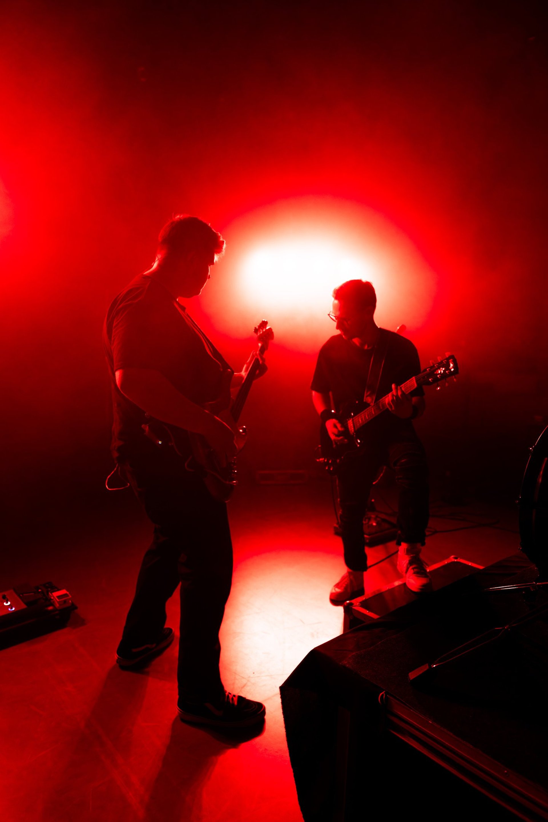 an abstract photo of a curved building with a blue sky in the background