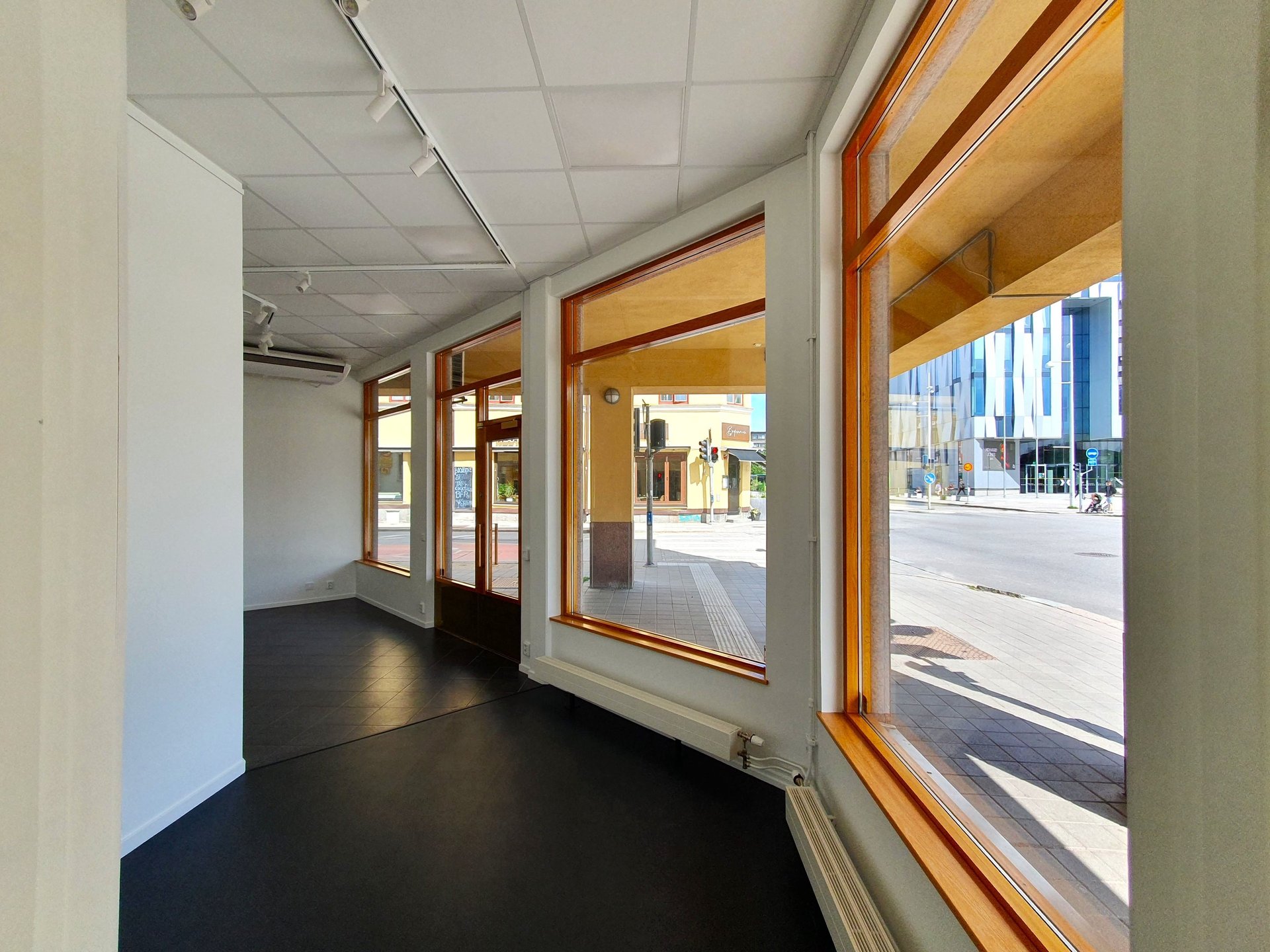 an abstract photo of a curved building with a blue sky in the background