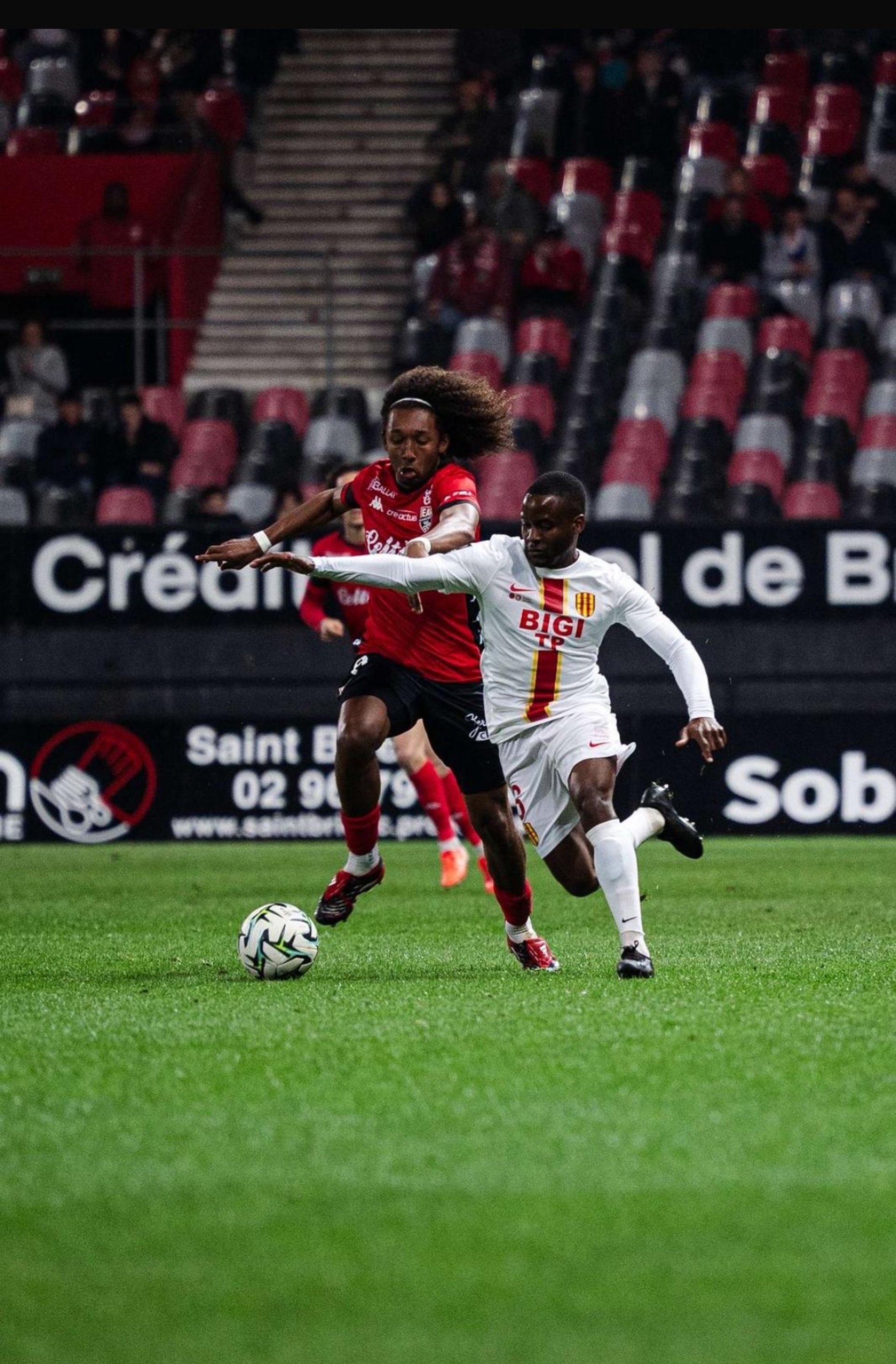 man playing soccer game on field