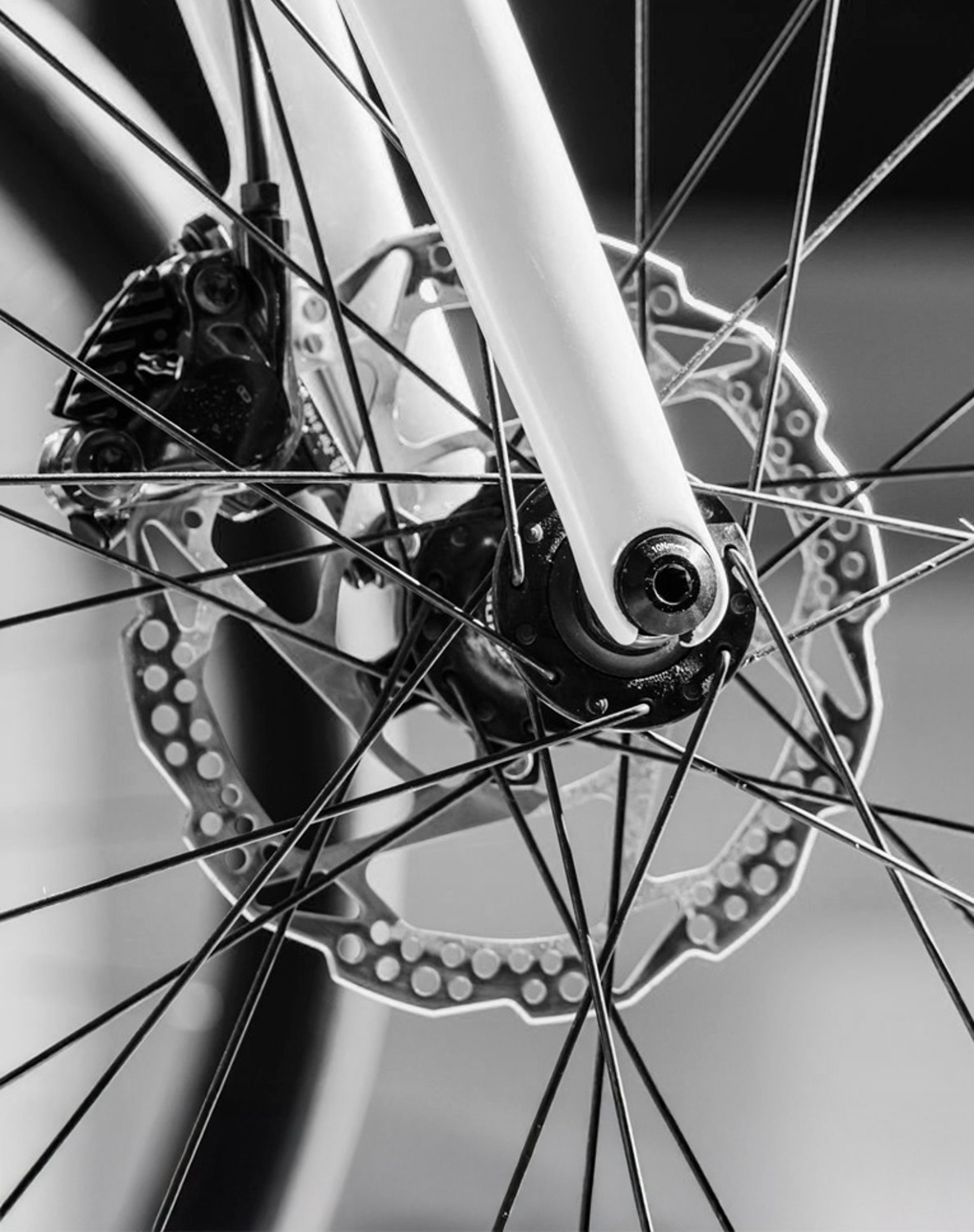 an abstract photo of a curved building with a blue sky in the background