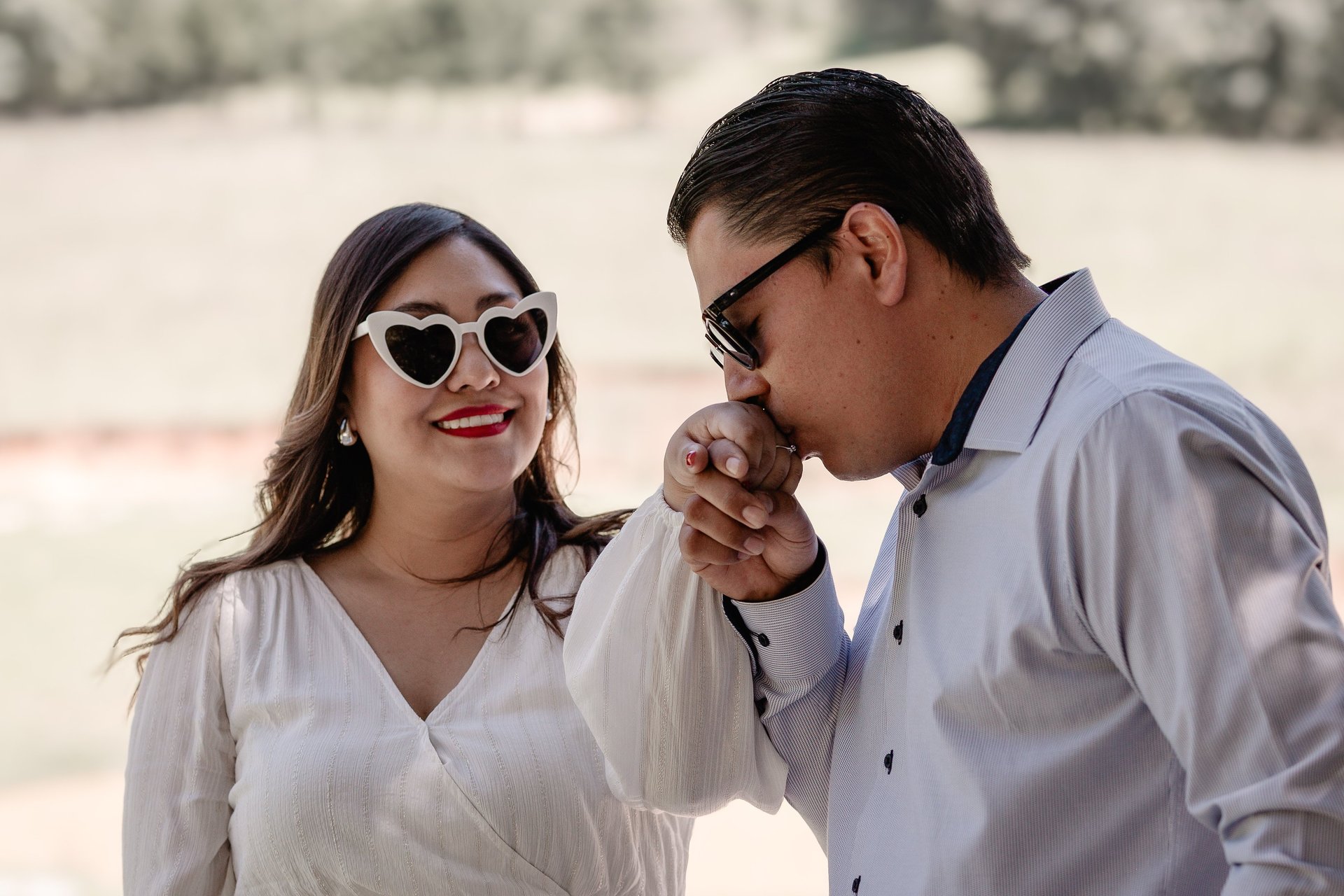couple wearing silver-colored rings
