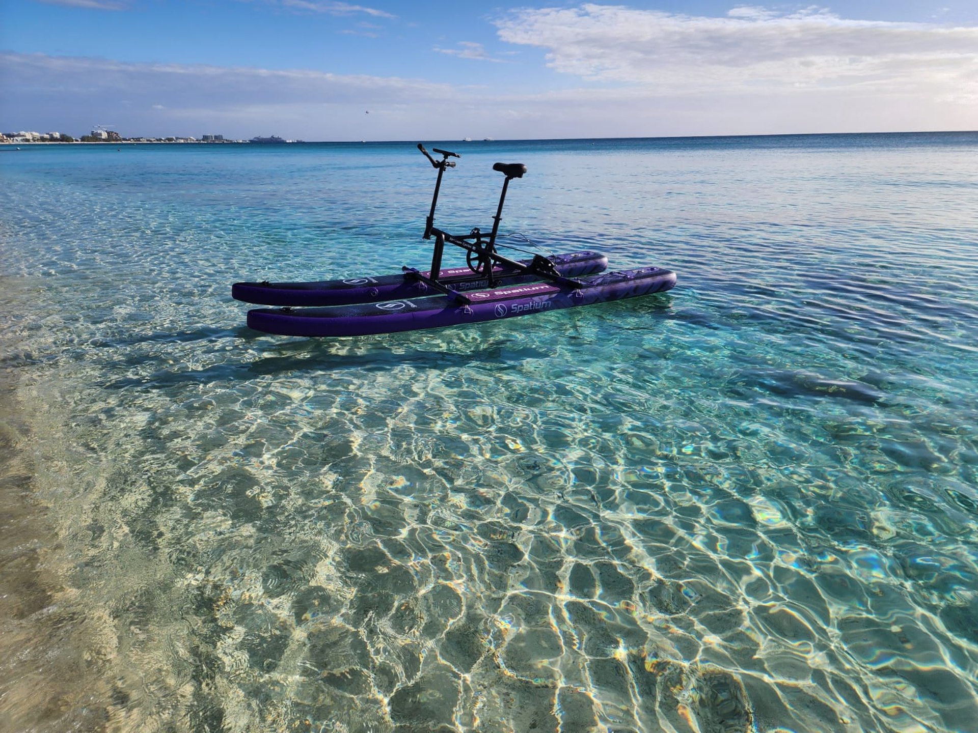 an abstract photo of a curved building with a blue sky in the background