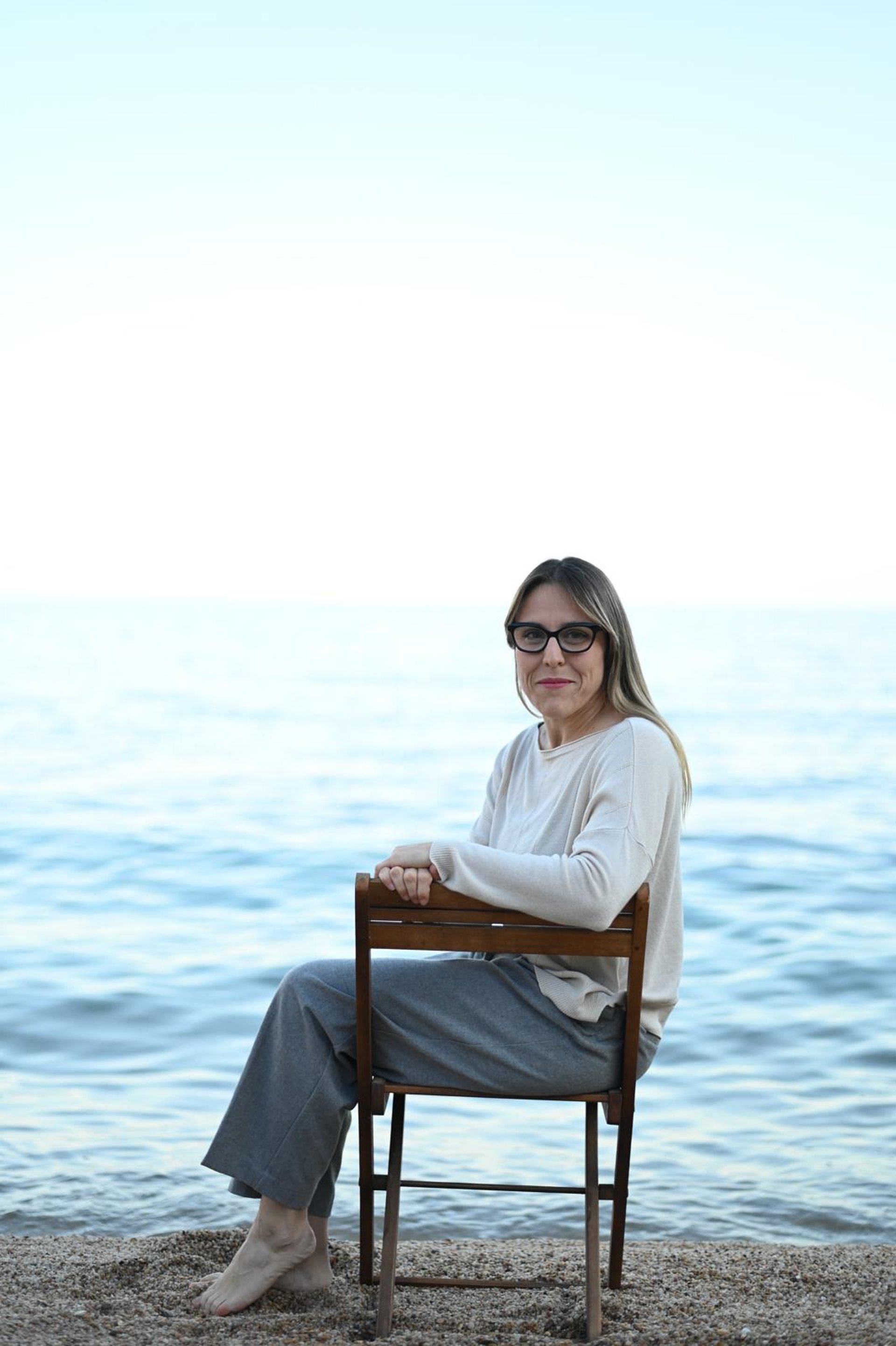 woman wearing yellow long-sleeved dress under white clouds and blue sky during daytime