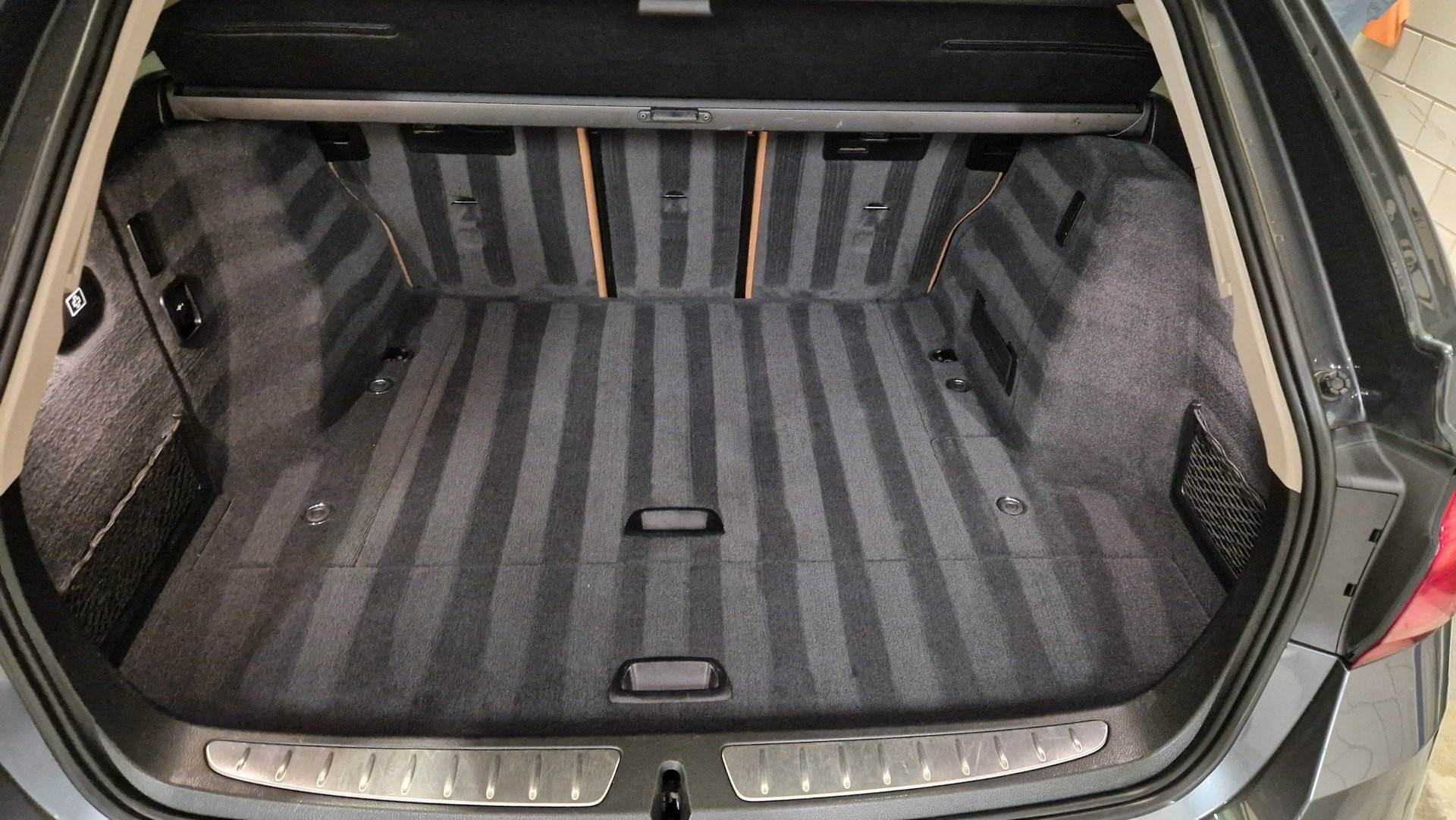 an abstract photo of a curved building with a blue sky in the background