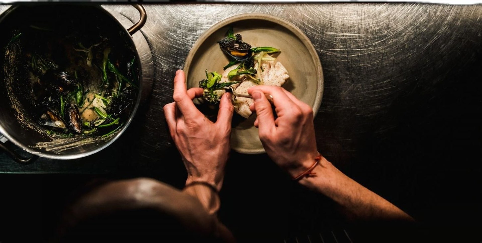 an abstract photo of a curved building with a blue sky in the background