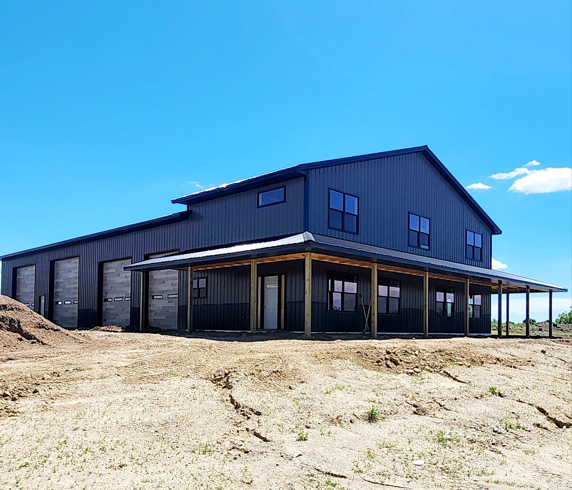 an abstract photo of a curved building with a blue sky in the background
