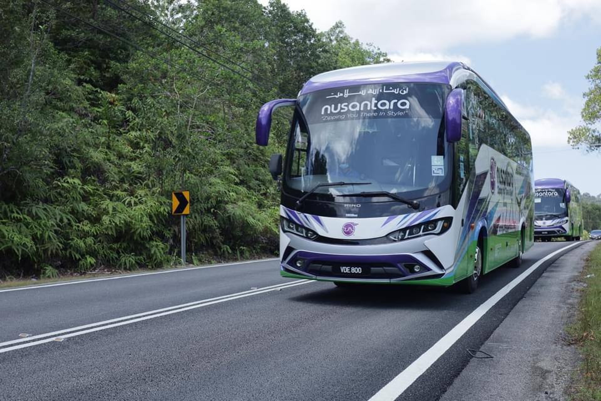 brown wooden house on lake