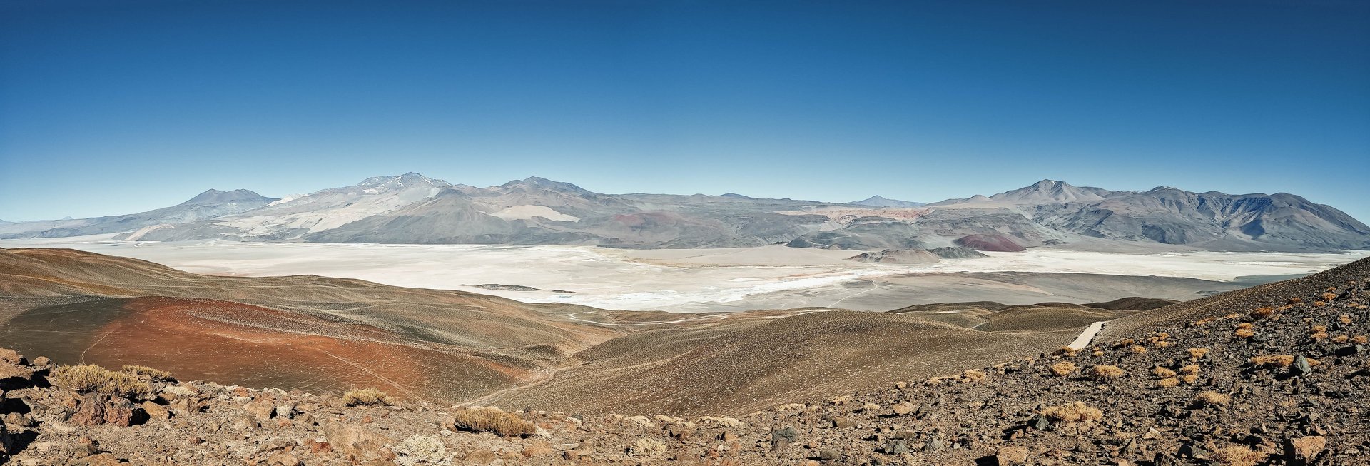 a large rock formation in the middle of a desert