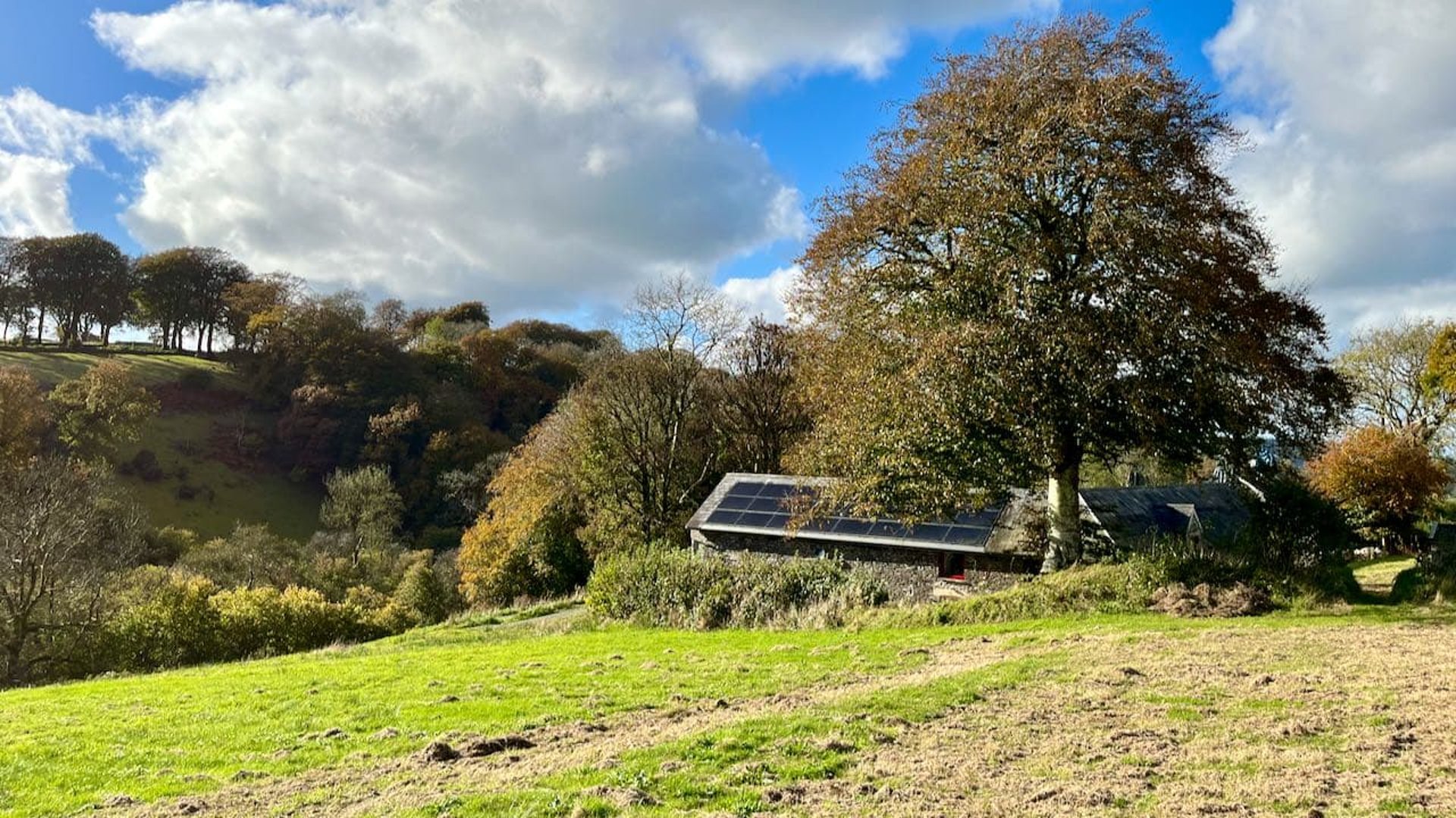 view of barns with pv's on roof