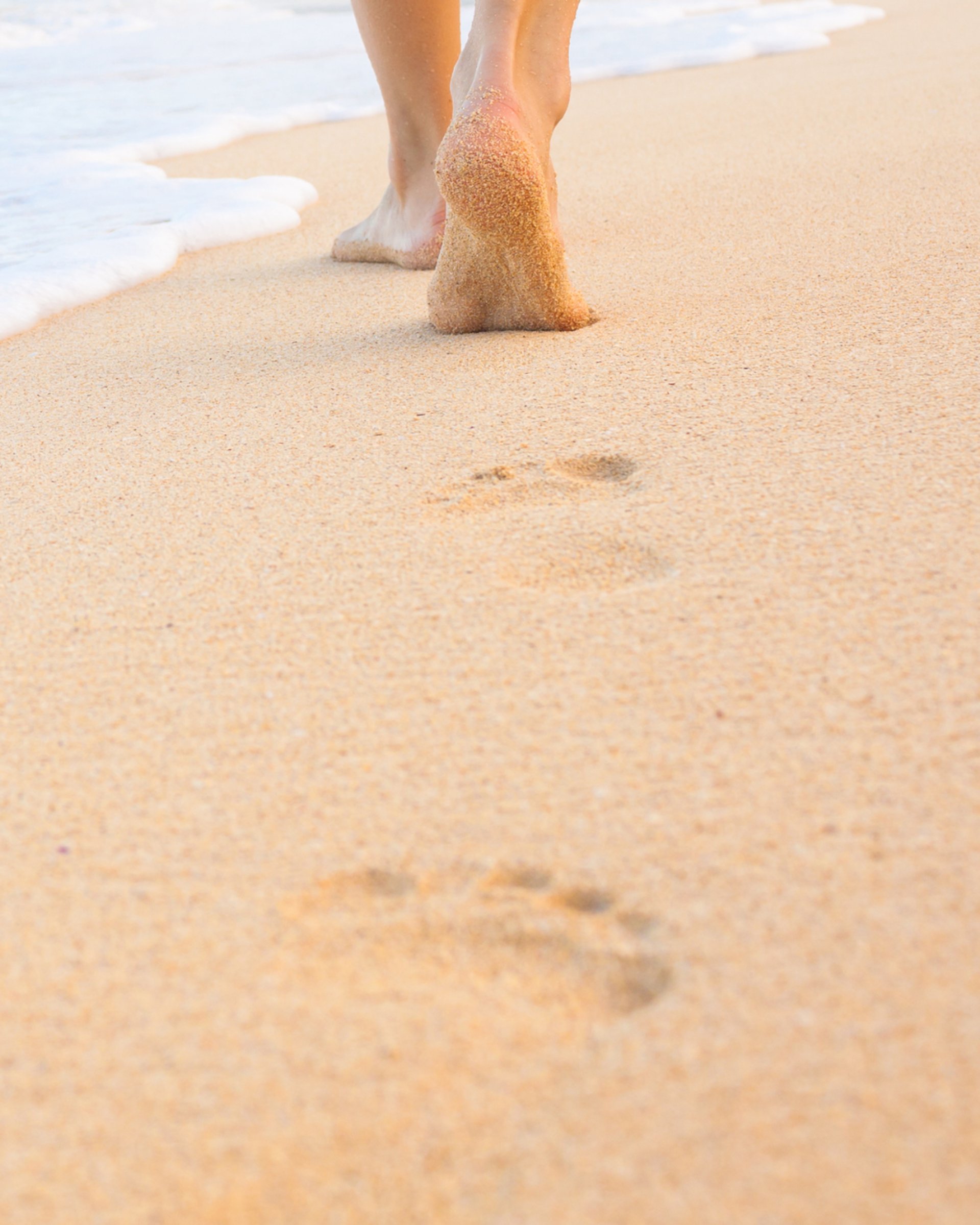 an abstract photo of a curved building with a blue sky in the background