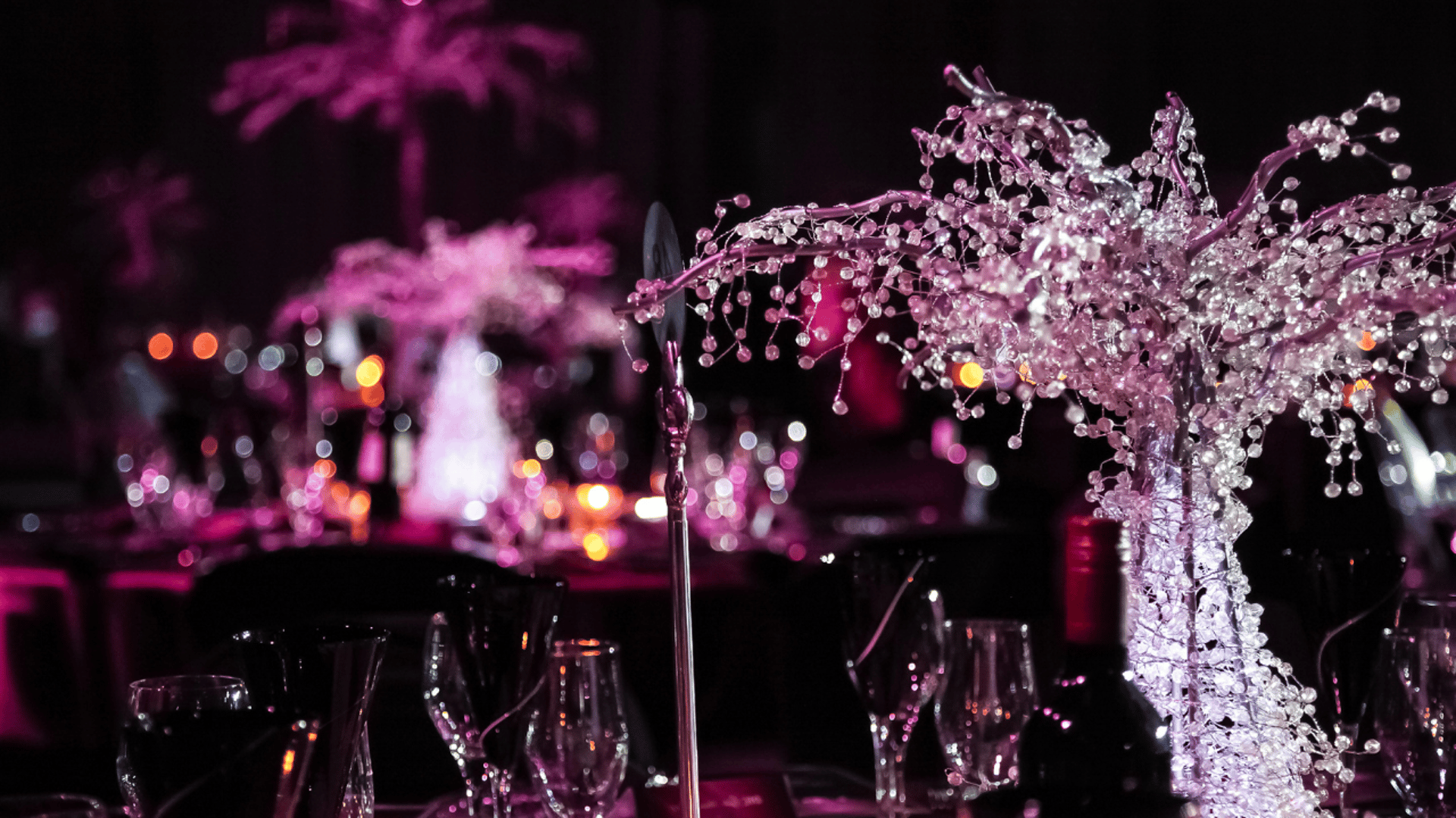 three clear wine glasses on the desk