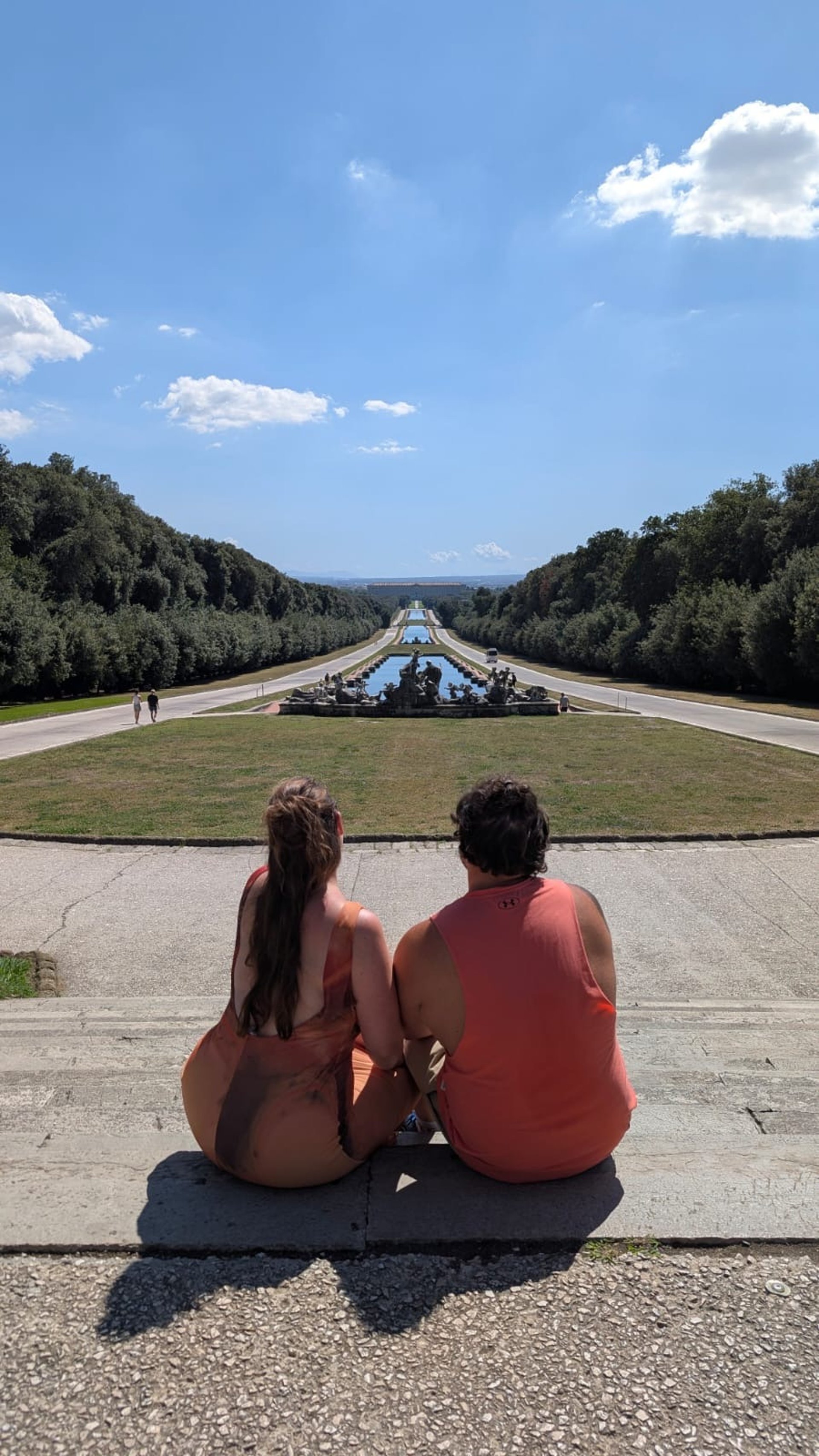an abstract photo of a curved building with a blue sky in the background